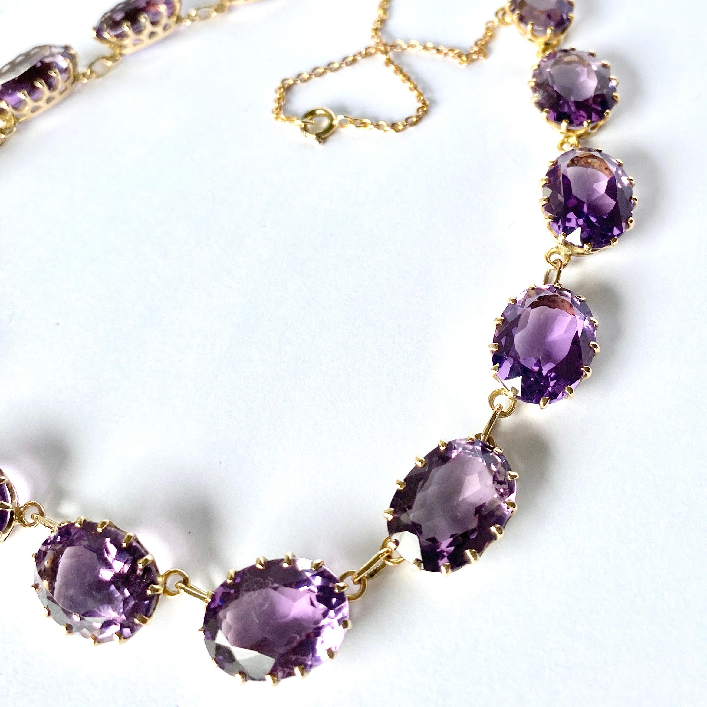 Fifteen stunning bright purple amethyst stones adorn this necklace. The 9ct gold chain is delicate compared to the chunky stones and is fastened using a bolt clasp.

Length: 45.5cm
Stone Dimensions: 8x13-19x14mm

Weight: 39.4g