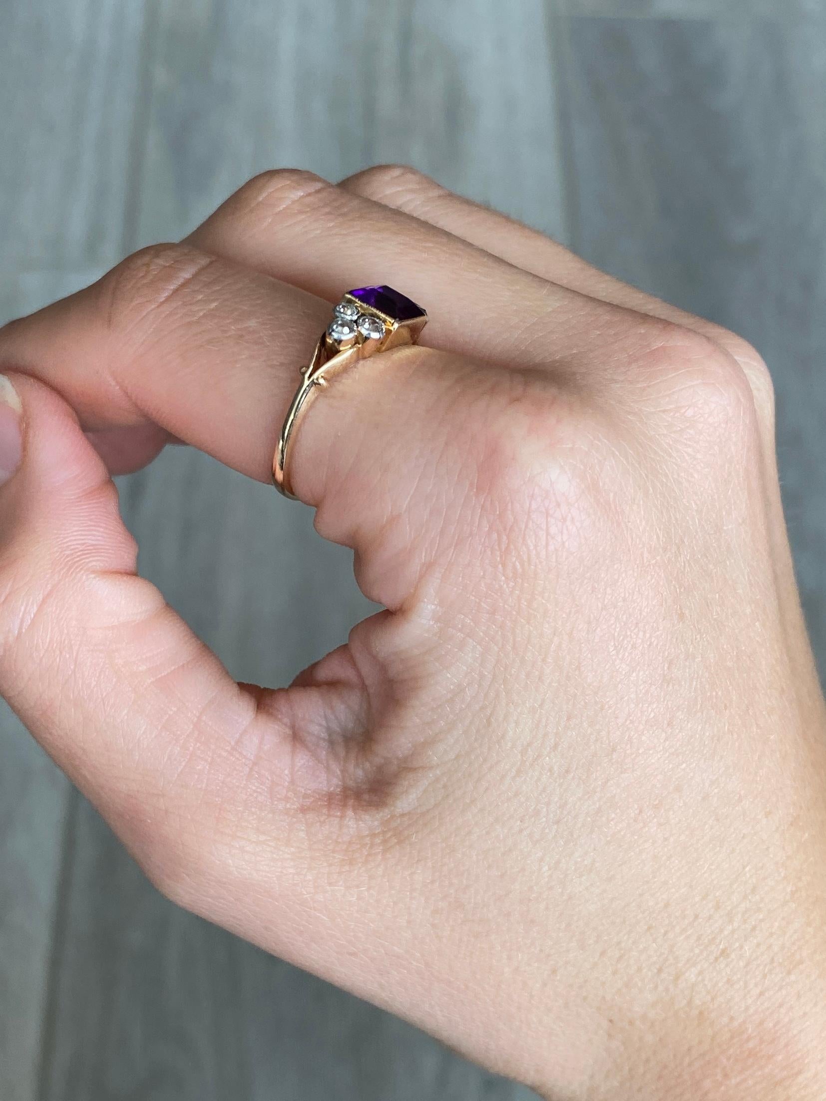 The amethyst stone in this ring is bright and a gorgeous colour. There are two trios of diamonds that sit either side of the central stone. Diamond total 30pts. Modelled in 18carat gold. Amethyst dimensions 6.5x6.5mm.

Ring Size: O 1/2 or 7 1/2