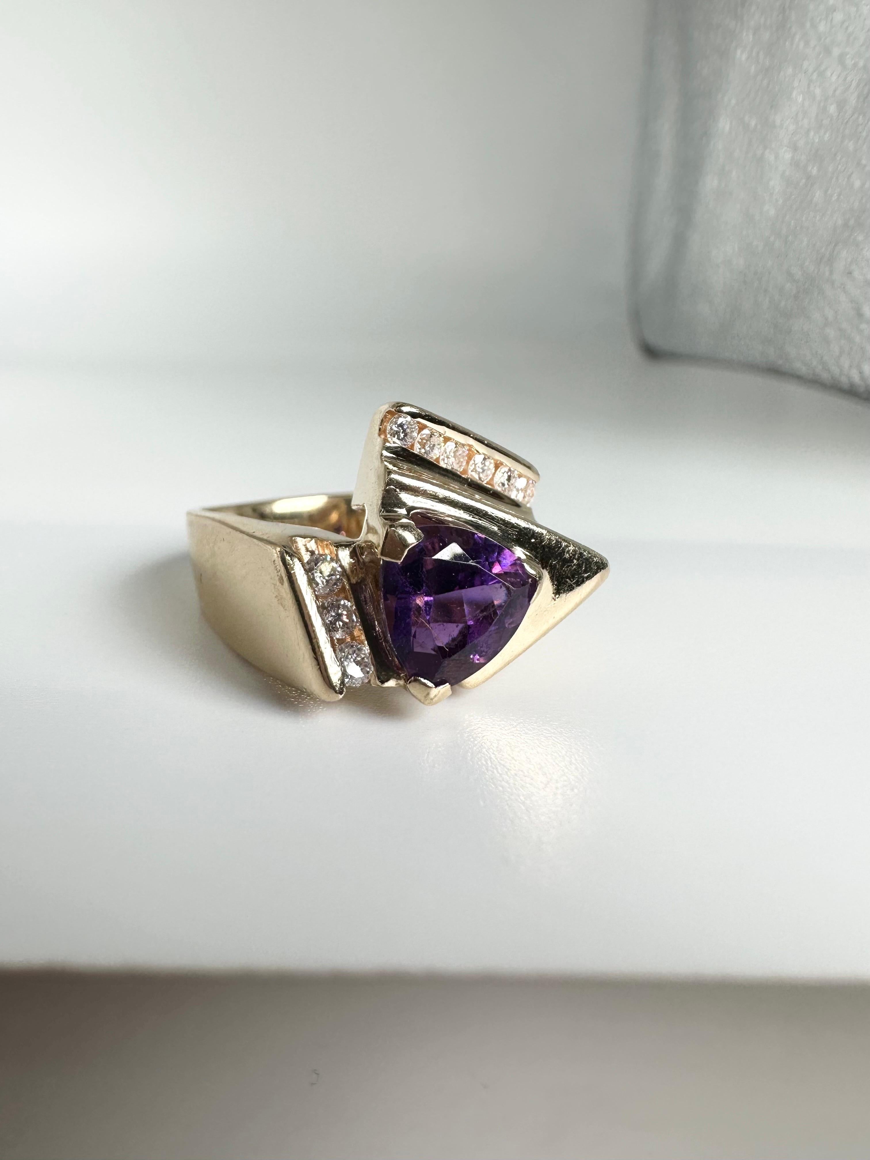 Lovely amethyst ring with diamonds made in art deco style! The center is 8.5mm trillion with beautiful purple rich color!

GOLD: 18KT gold
NATURAL DIAMOND(S)
Clarity/Color: VS/F
Carat:0.27ct 
Cut:Heart Brilliant
Grams:11.54
Item 20000071eaf

WHAT