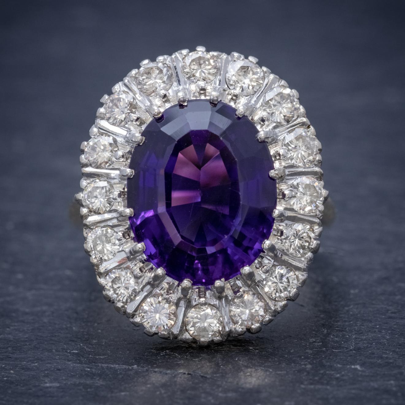 A spectacular Art Deco ring claw set with a beautiful deep purple Amethyst which is over 6ct and haloed by sparkling Diamonds which total to approx. 1.30ct.  

The stones are set in a large 18ct White Gold face and fitted to an 18ct Yellow Gold