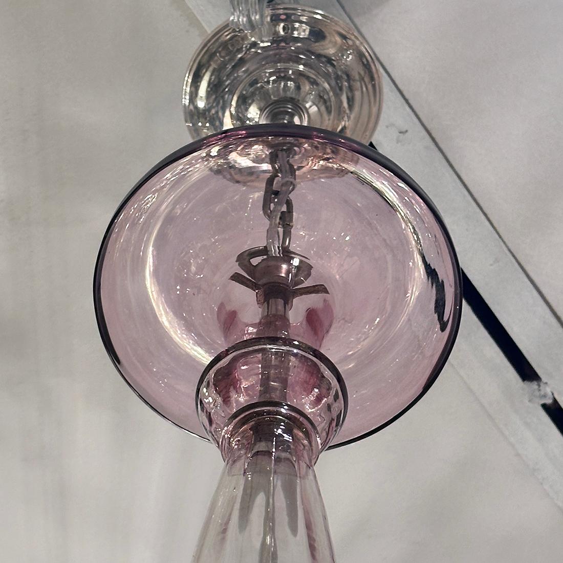 A circa 1940's amethyst glass Murano chandelier with 5 lights.

Measurements:
Height of body: 32