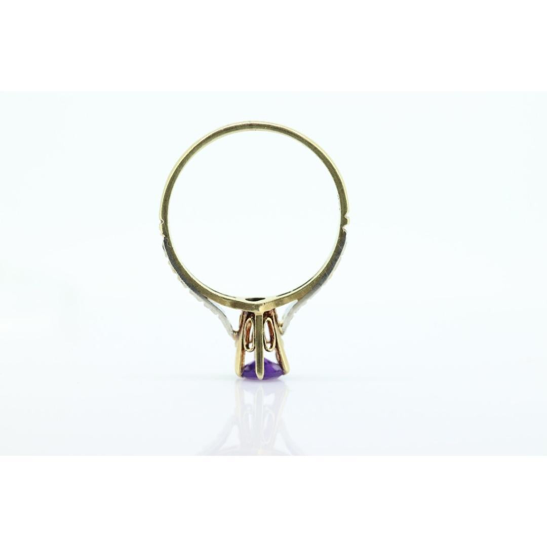 Vintage from the 1920s
Materials: Gold, Platinum, Rose gold, White gold
Gemstone: Amethyst
Gem color: Purple
Band color: Gold
Style: Art deco
Super unique vintage ring. Deep purple amethysts set into 14k gold ring.

Antique High Cathedral setting