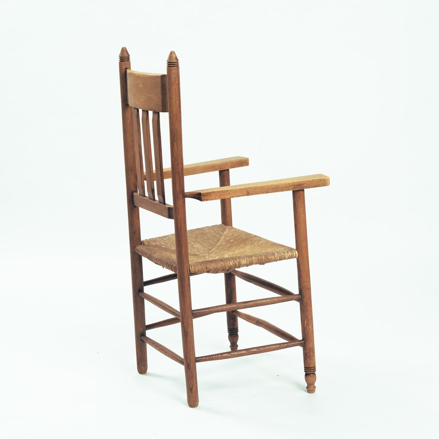 Art Deco Amsterdam School armchair in oak with straw seat, The netherlands, 1930 In Good Condition For Sale In Zevenaar, NL
