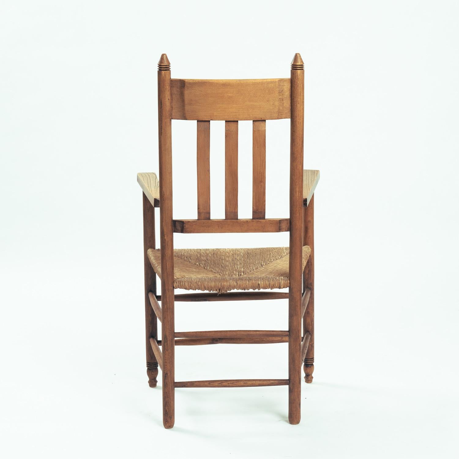 Mid-20th Century Art Deco Amsterdam School armchair in oak with straw seat, The netherlands, 1930 For Sale