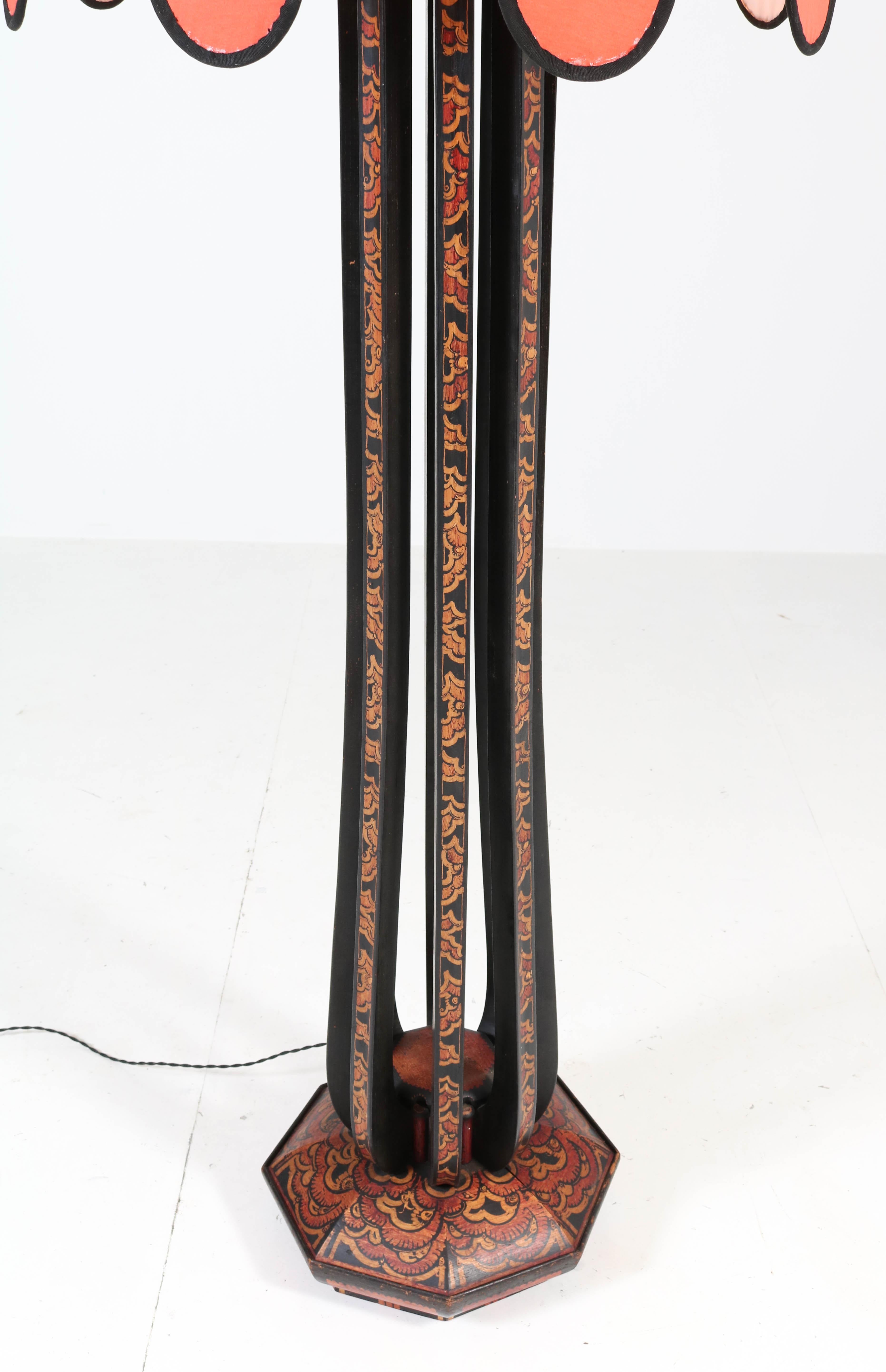 Magnificent and rare Art Deco Amsterdam School floor lamp.
Design by Louis Bogtman Hilversum.
Striking Dutch design from the 1920s.
Fruitwood with original batik decoration.
Re-upholstered shade with shantung silk.
Rewired with one socket for