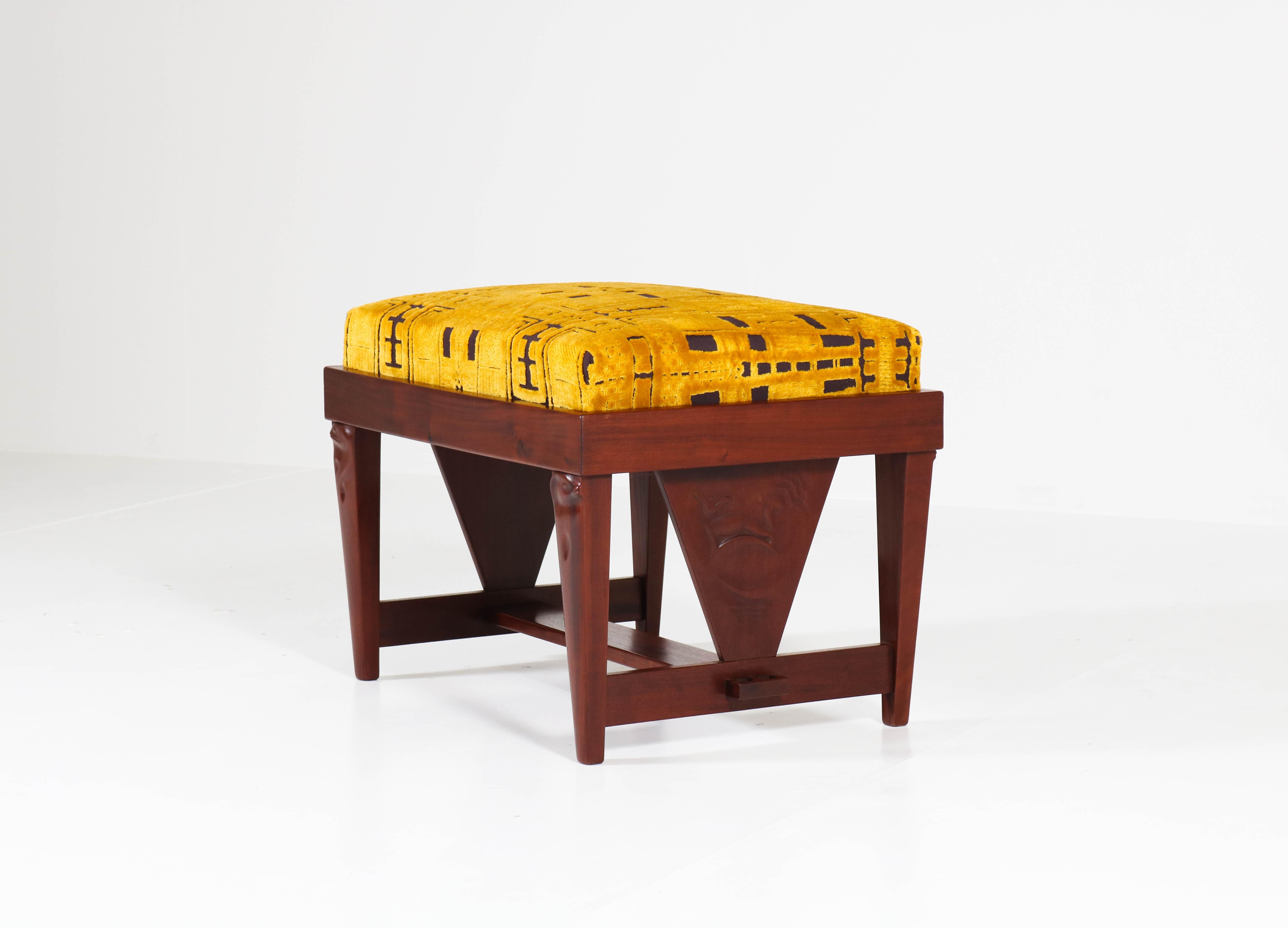 Magnificent and extremely rare Art Deco Amsterdam School stool.
Design by Willem Raedecker.
Striking Dutch design from the twenties.
Solid mahogany with hand carved female heads and hand carved animals.
Newly upholstered with wonderful