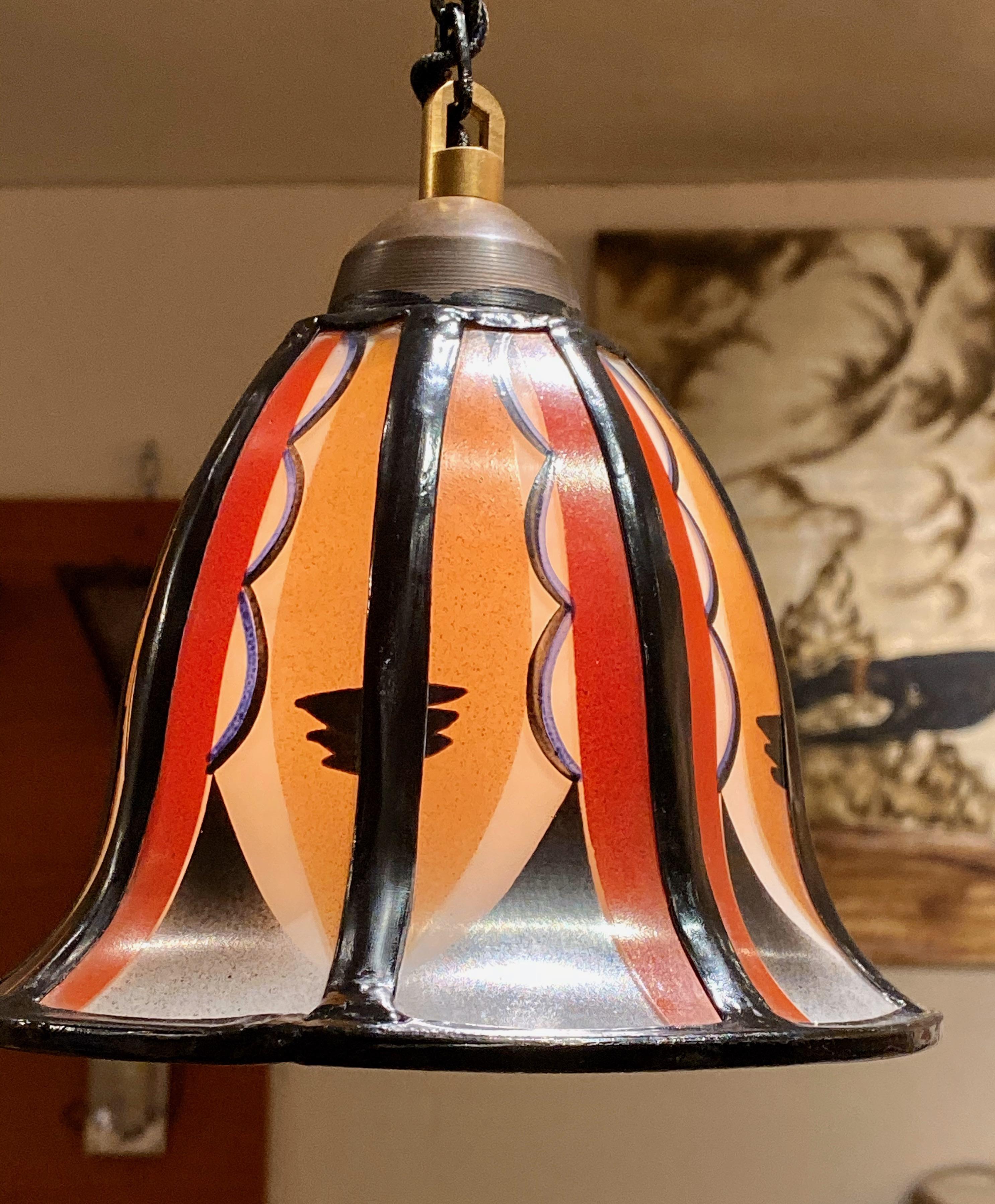 Art Deco Amsterdam School stained glass hanging lamps. Two beautiful Amsterdam School Art Deco stained hanging lamps made by ‘De Nieuwe Honsel’. The stained glass lamps have a length, including the suspension, of 37.5? But could easily be adjust to