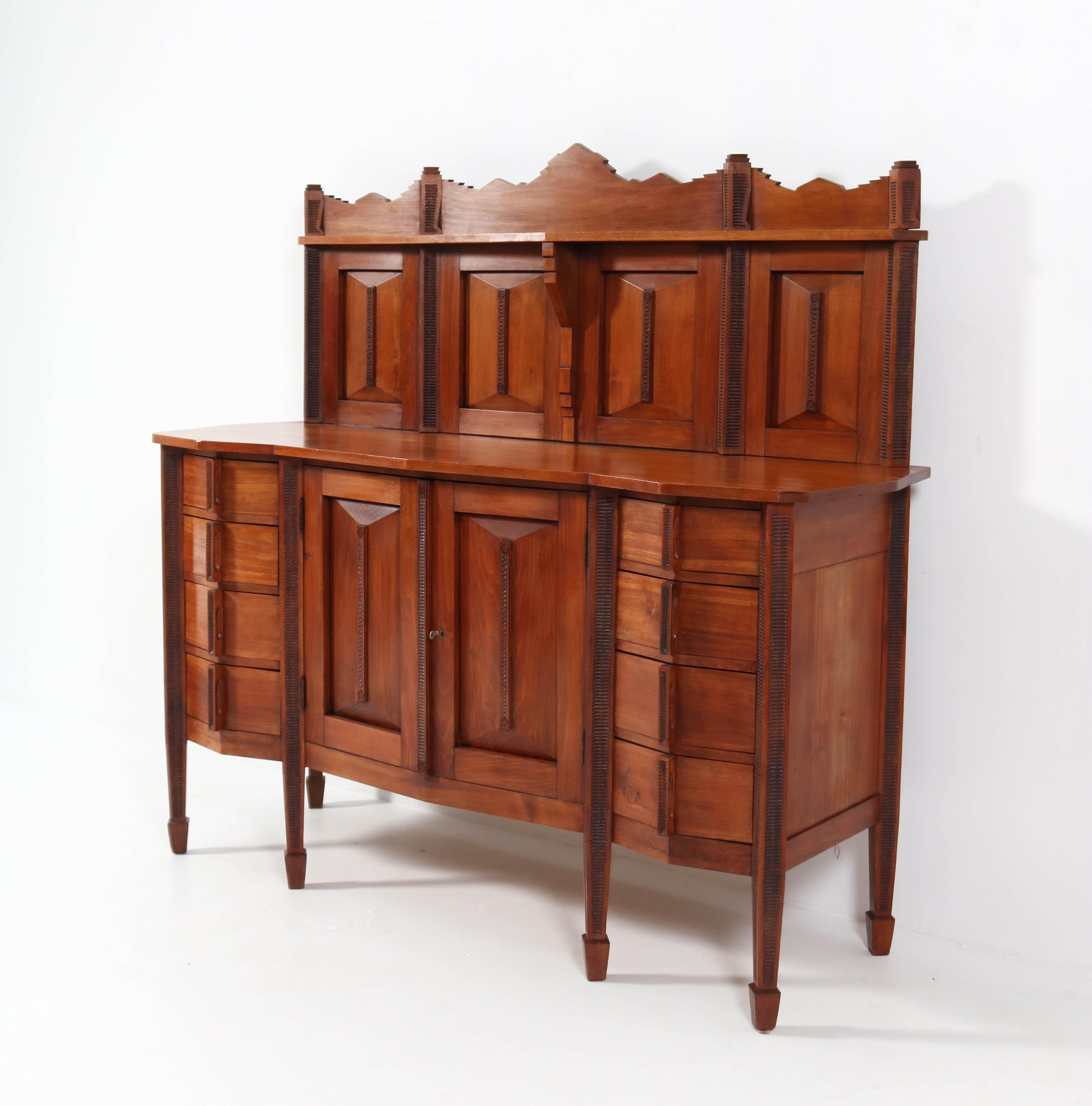 Magnificent and ultra rare Art Deco Amsterdamse School credenza or sideboard.
Striking Dutch design from the 1920s.
Solid stained beech.
This wonderful piece of furniture with its remarkable design is a true gem in a Amsterdamse School interior or