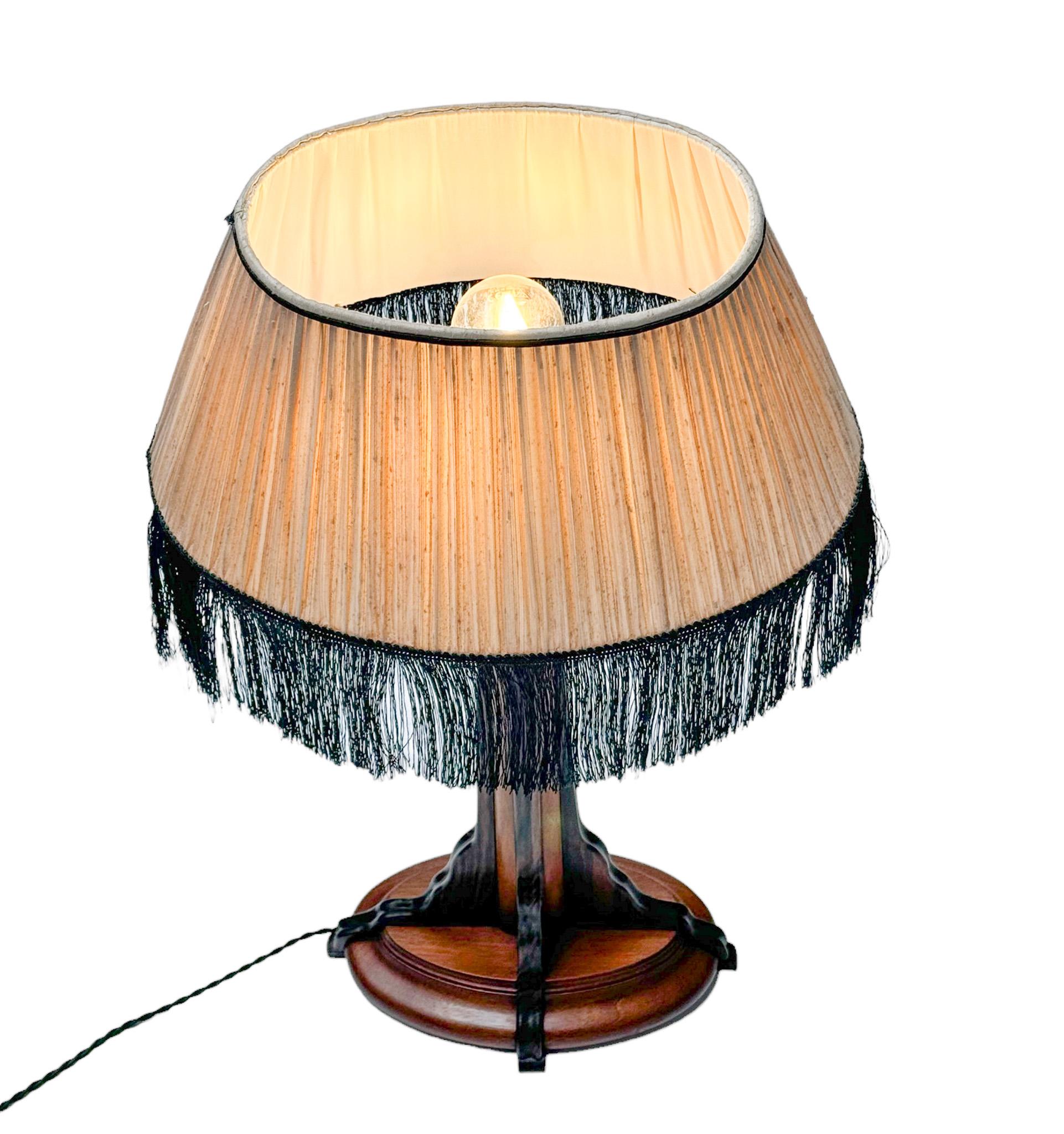Stunning and rare Art Deco Amsterdamse School table lamp.
Striking Dutch design from the 1920s.
Solid walnut base with solid macassar ebony decorative elements.
New ivory white fabric shade with black lining.
Rewired with one socket for E-27 light