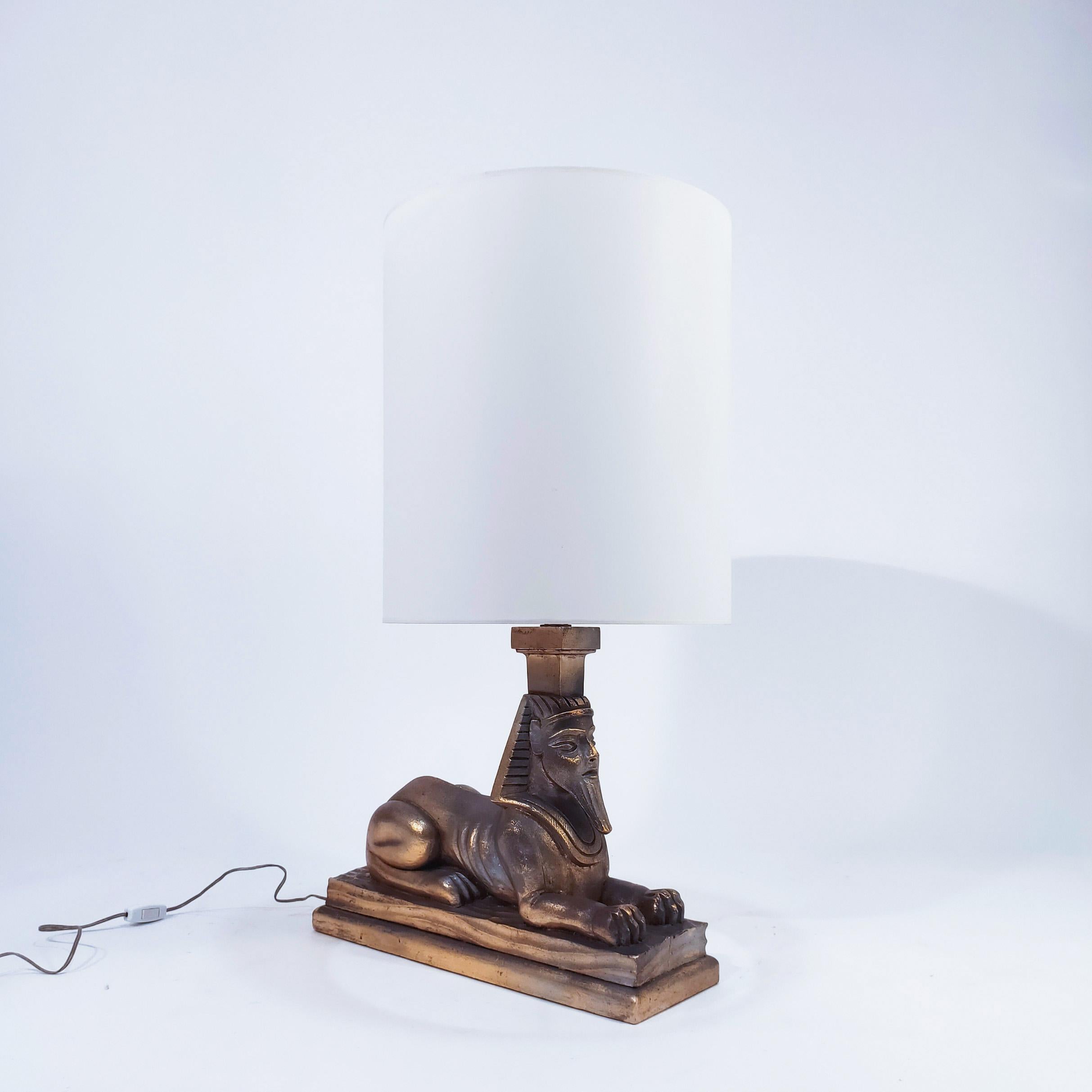 Intagliato a mano Art Deco and Egyptian style gilded table lamp, Spain, 1960s in vendita
