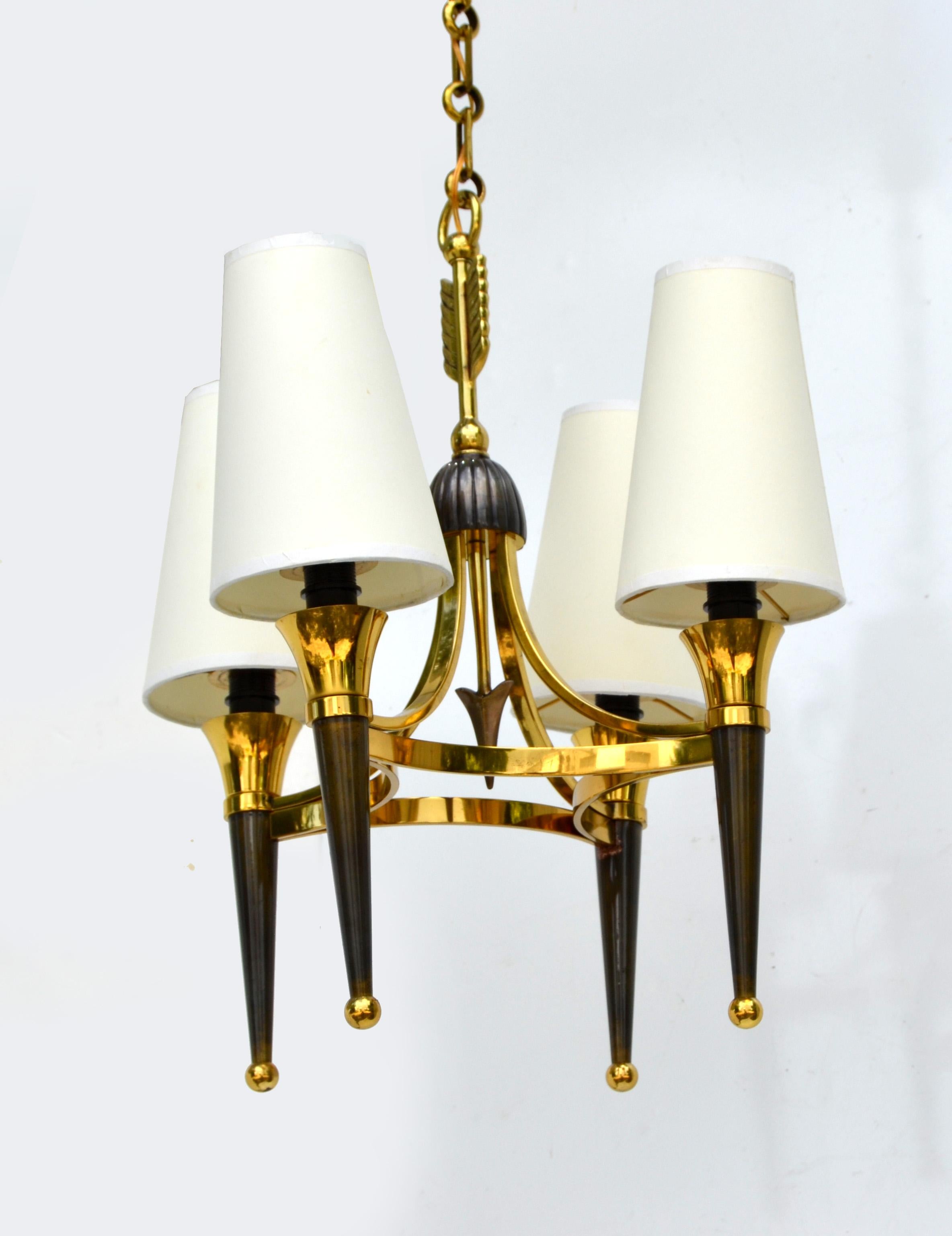 Superb Andre Arbus style 4-light chandelier Art Deco Period circa 1940.
Brass Arrow in the Center of the Chandelier and comes with 4 Cone Shaped Off White Paper Shades. 
Two patinas in brass and gun metal. US rewired and in working condition 4