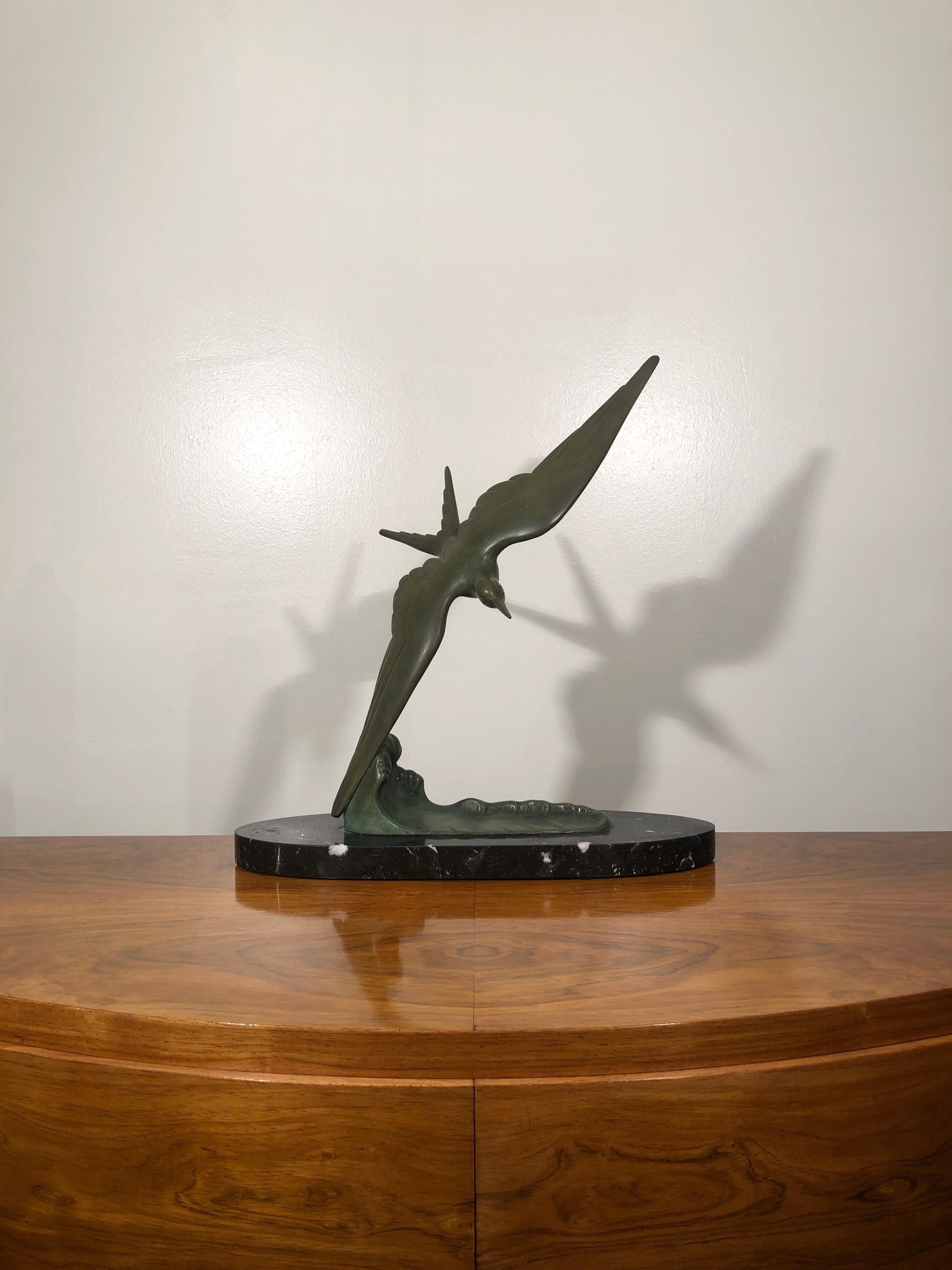 Art Deco animal bird shaped bronze sculpture on marble base, signed Secondo.

Secondo was a French Artist active in the first part of 20th century. 

The animal body is separated from the base, the wing end fits the metal base. The sculpture is