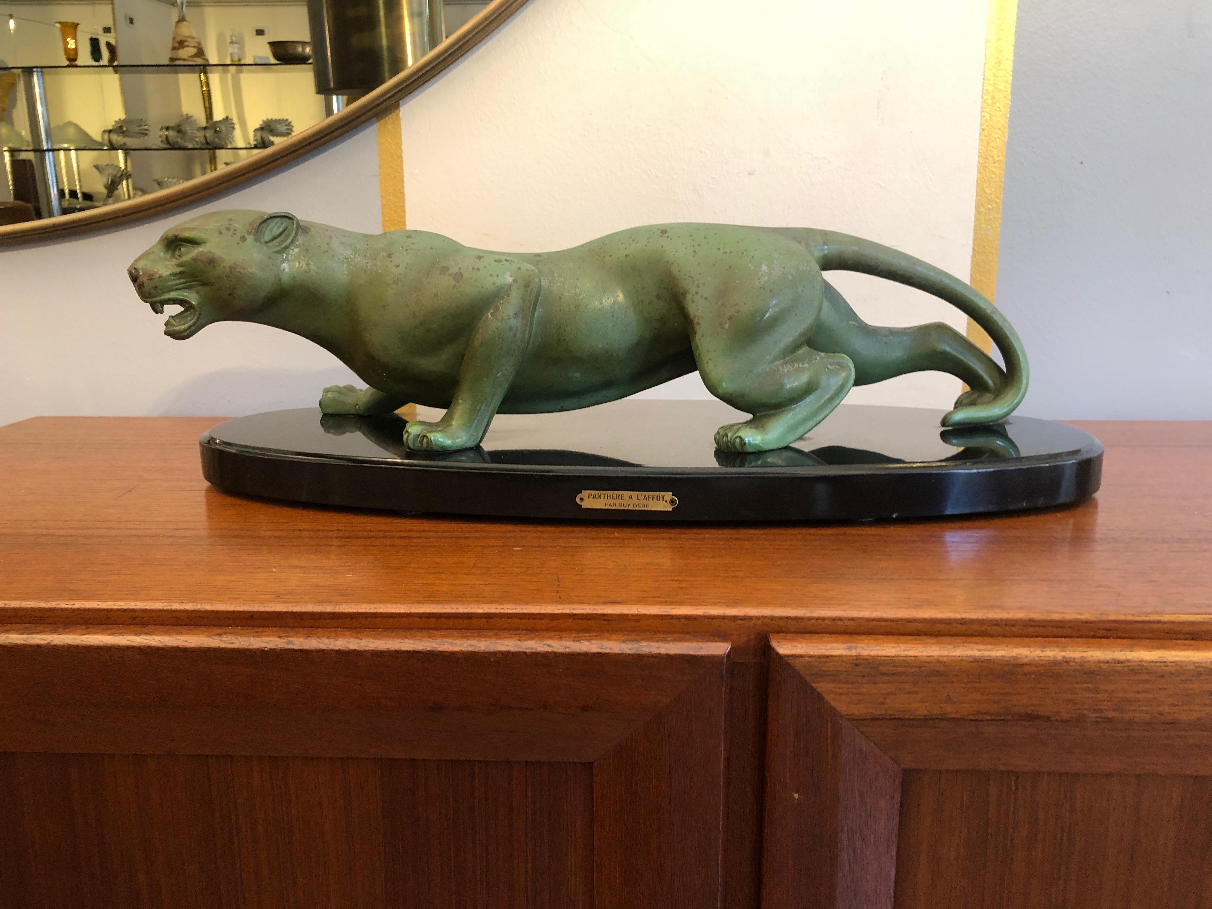Art Deco animal bronze sculpture panther by Guy Debe on black oval marble base.

Art Deco sculpture representing a Panther during a hunting moment. This sculpture is made by Art Deco sculptor Guy Debe, an artist active during the early 20th