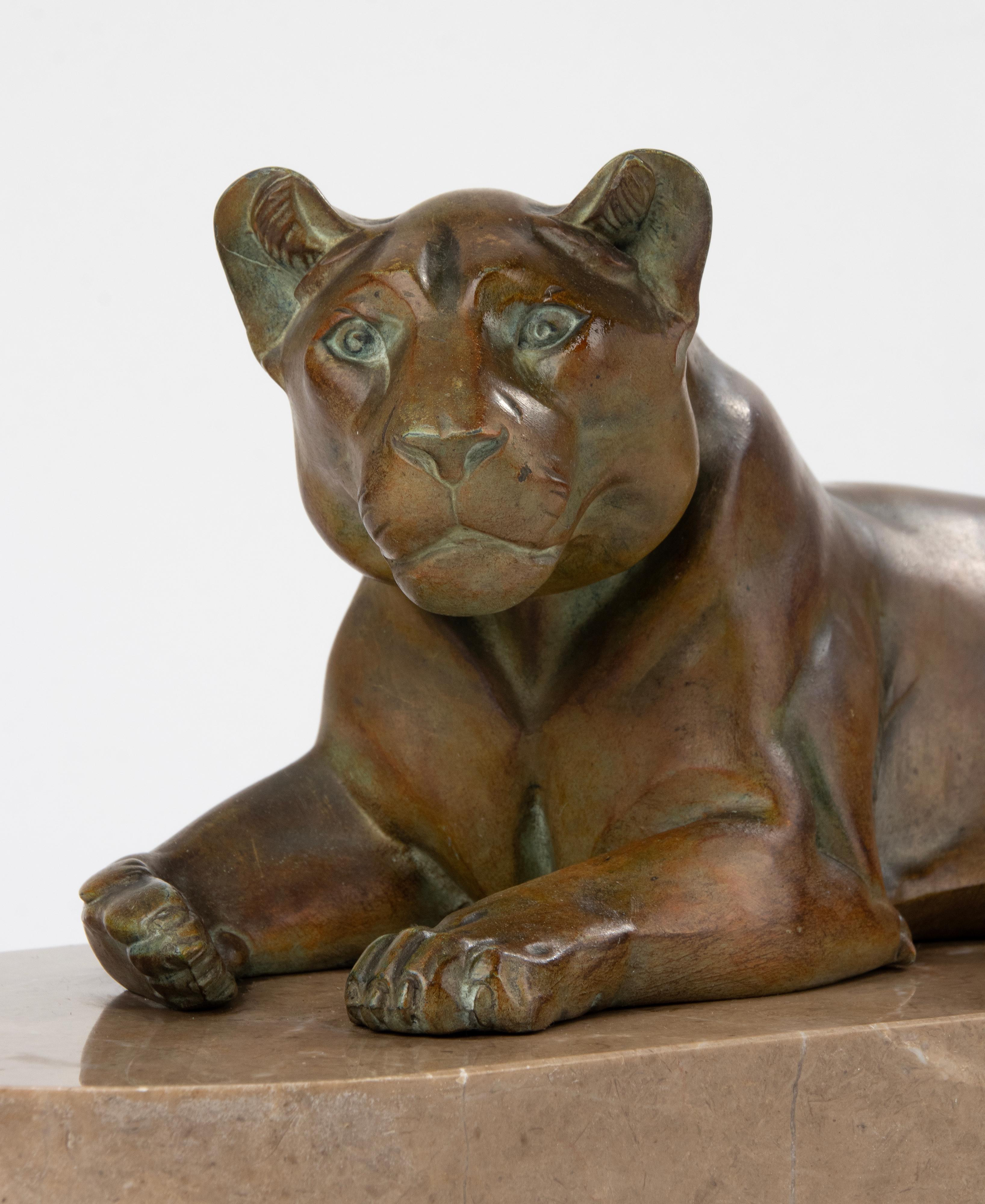 Early 20th Century Art Deco Animal Sculpture of a Lioness Made of Spelter and Marble