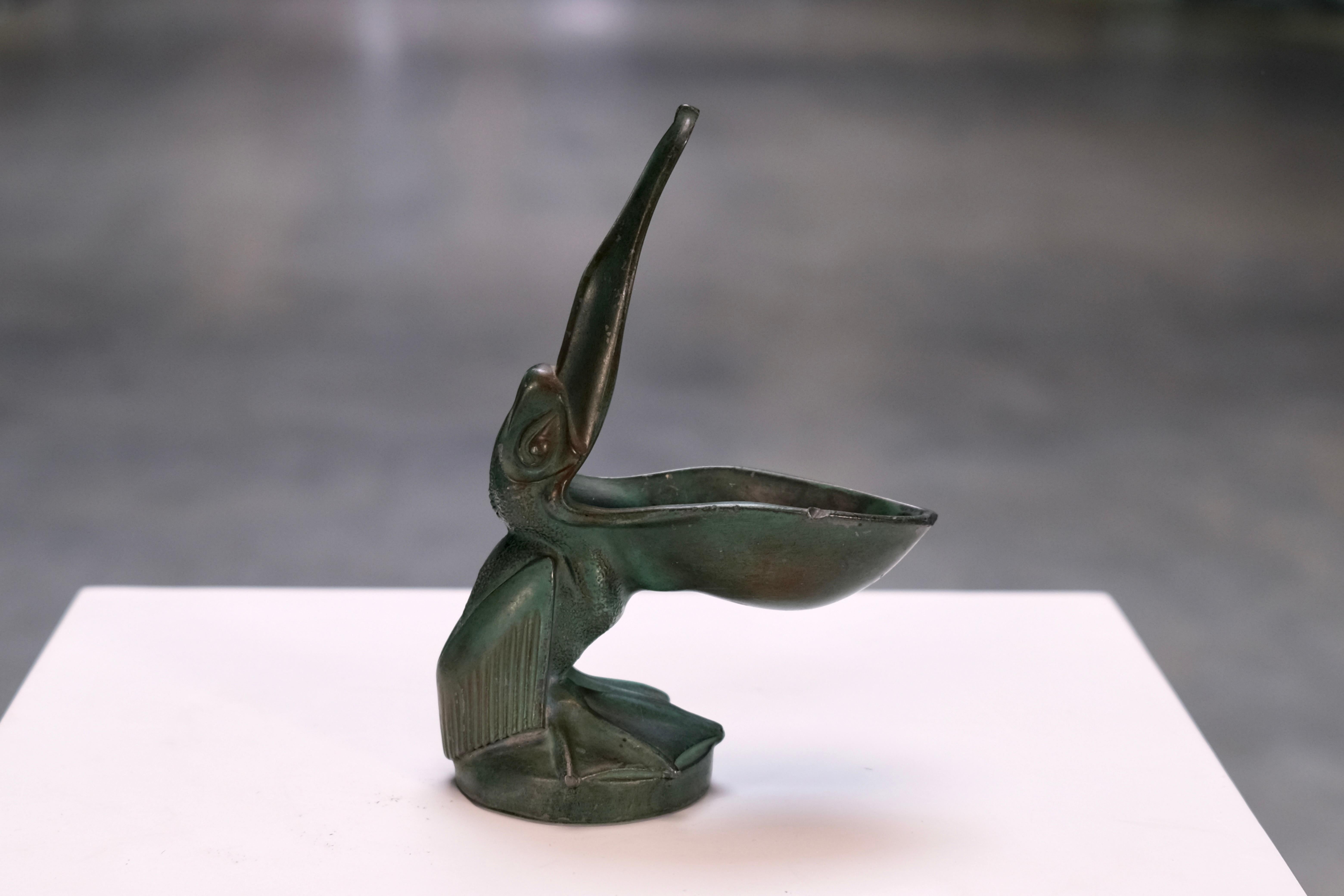 Whimsical Art Deco pelican trinket dish in R�égule by Max Le Verrier – a rare decorative object full of wit, charm and French flair.

This compact, sculptural piece was cast in Régule (spelter), a favored material of the 1920s and ’30s that allowed