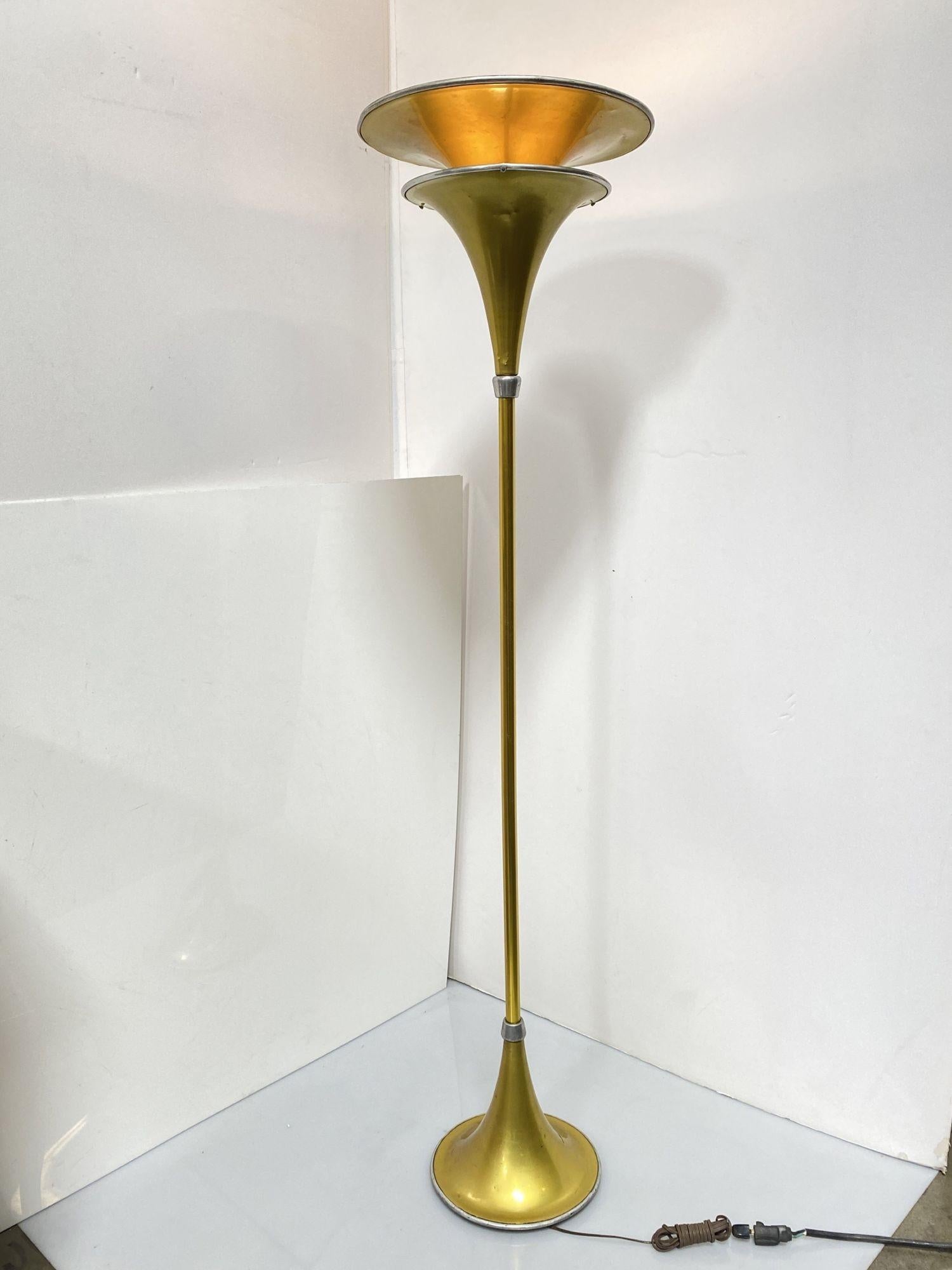 Rare Art Deco, machine-age anodized aluminum torchiere floor lamp. Classic two tier top, as well as unusual trumpet base, gold color, 16