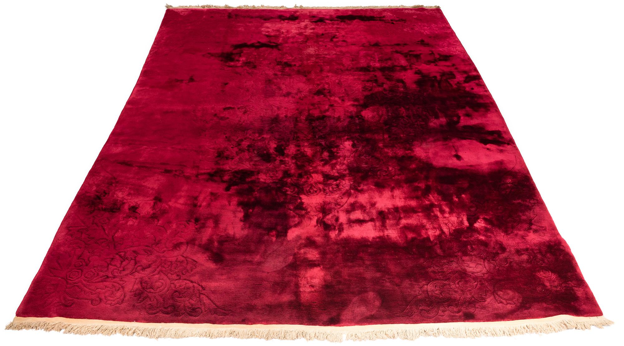 Art Deco Chinese rug with deep pile wool in burgundy with tone on tone woven floral motif. By the 1930s boarders disappeared on the Chinese Art Deco rugs and were hand woven with nearly empty fields.  The tone on tone weaving of this rug creates an