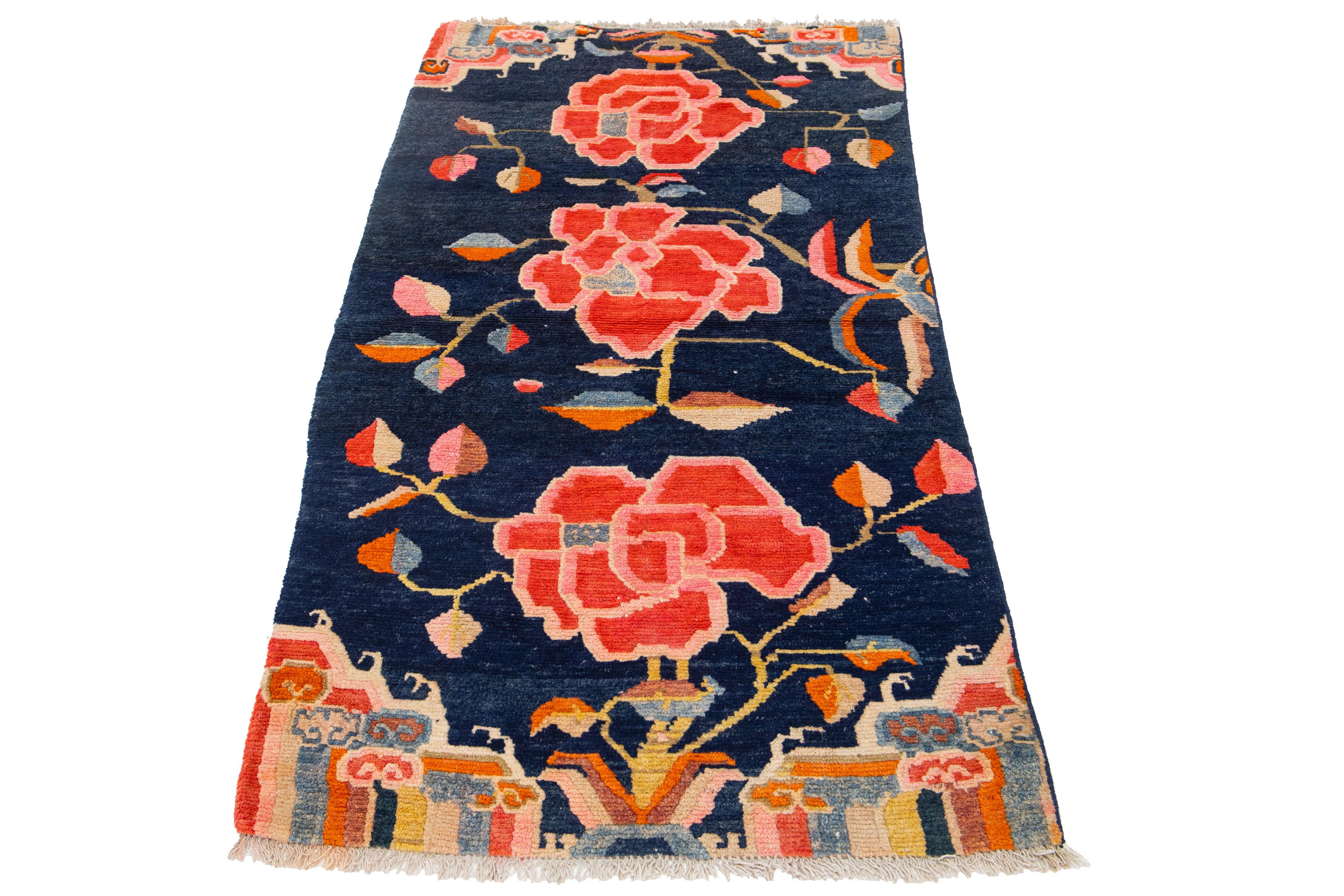 Beautiful antique Chinese Art Deco hand-knotted scatter wool rug with navy blue color field. This piece has multicolor hues adorned with a classic Chinese floral design.


This rug measures 2' 9