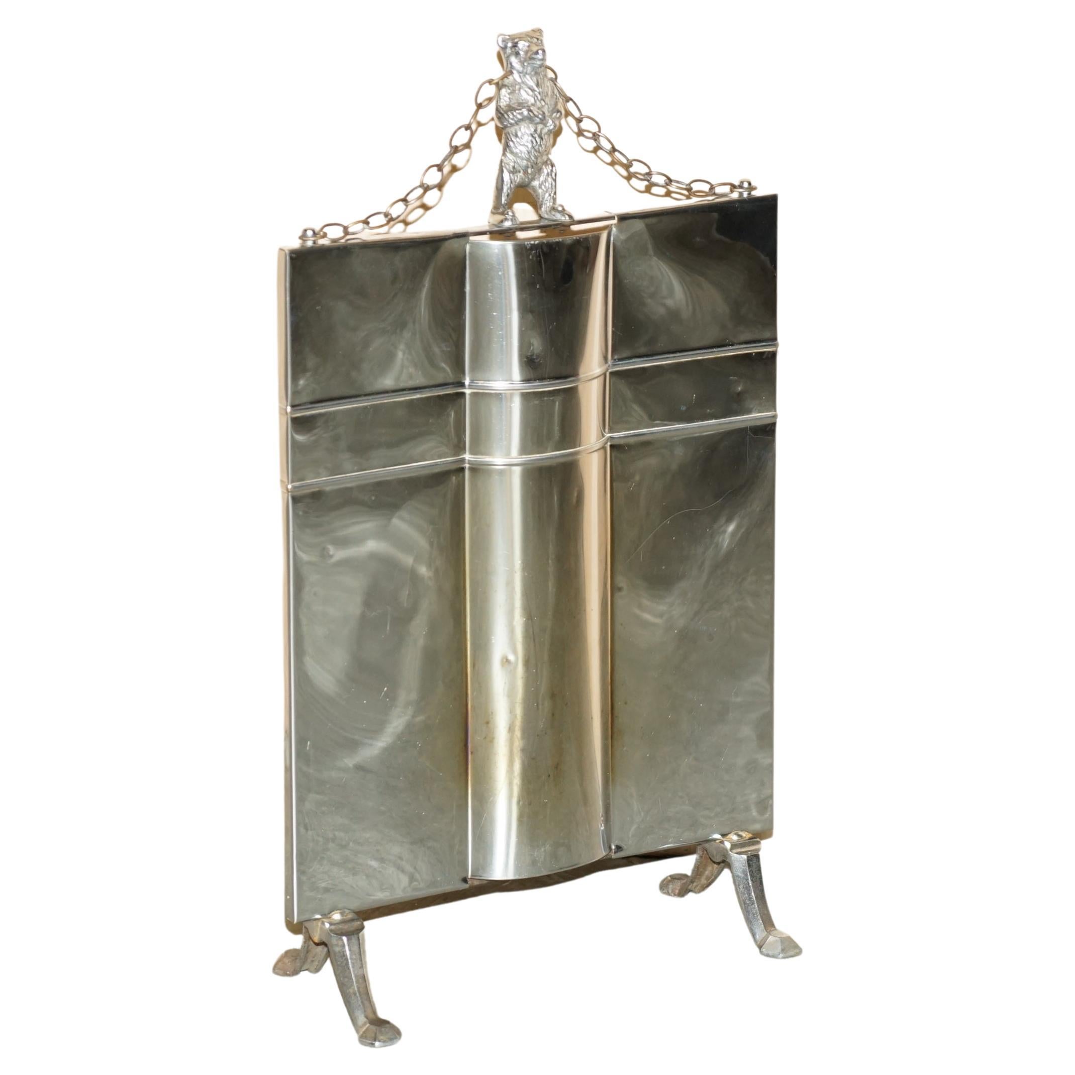Royal House Antiques

Royal House Antiques is delighted to offer for sale this stunning circa 1920'S Art Deco polished chrome with Bear on top Fire Screen or Guard

A very good looking and well made piece, it is super decorative and looks attractive