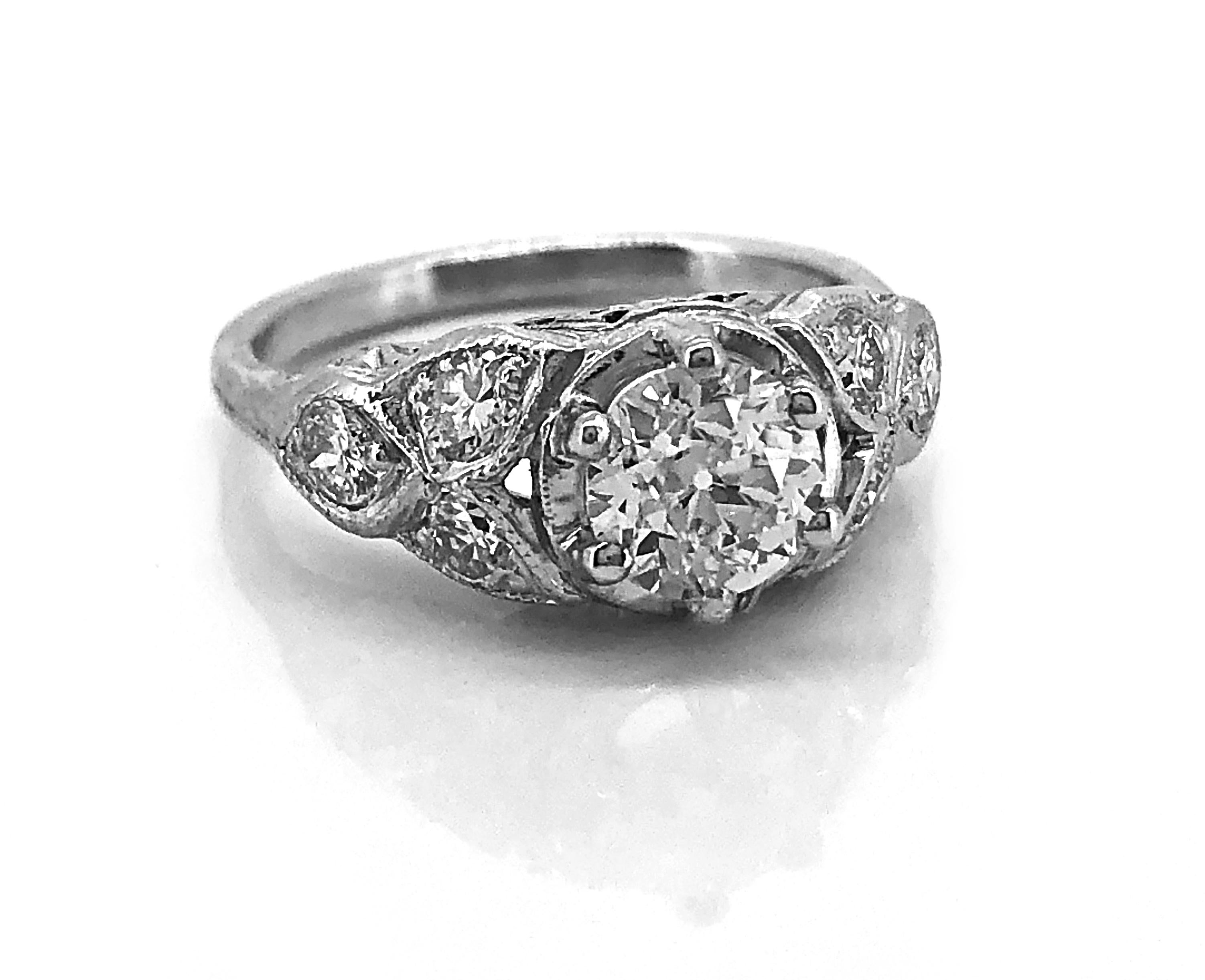 WOW! A stunning 18K White Gold Art Deco Antique engagement ring featuring a sparkling .85ct. apx. European cut diamond with VS1 clarity and G color. There are accenting .50ct. apx. T.W. European cut diamonds with VS2-SI1 clarity and H-I color.