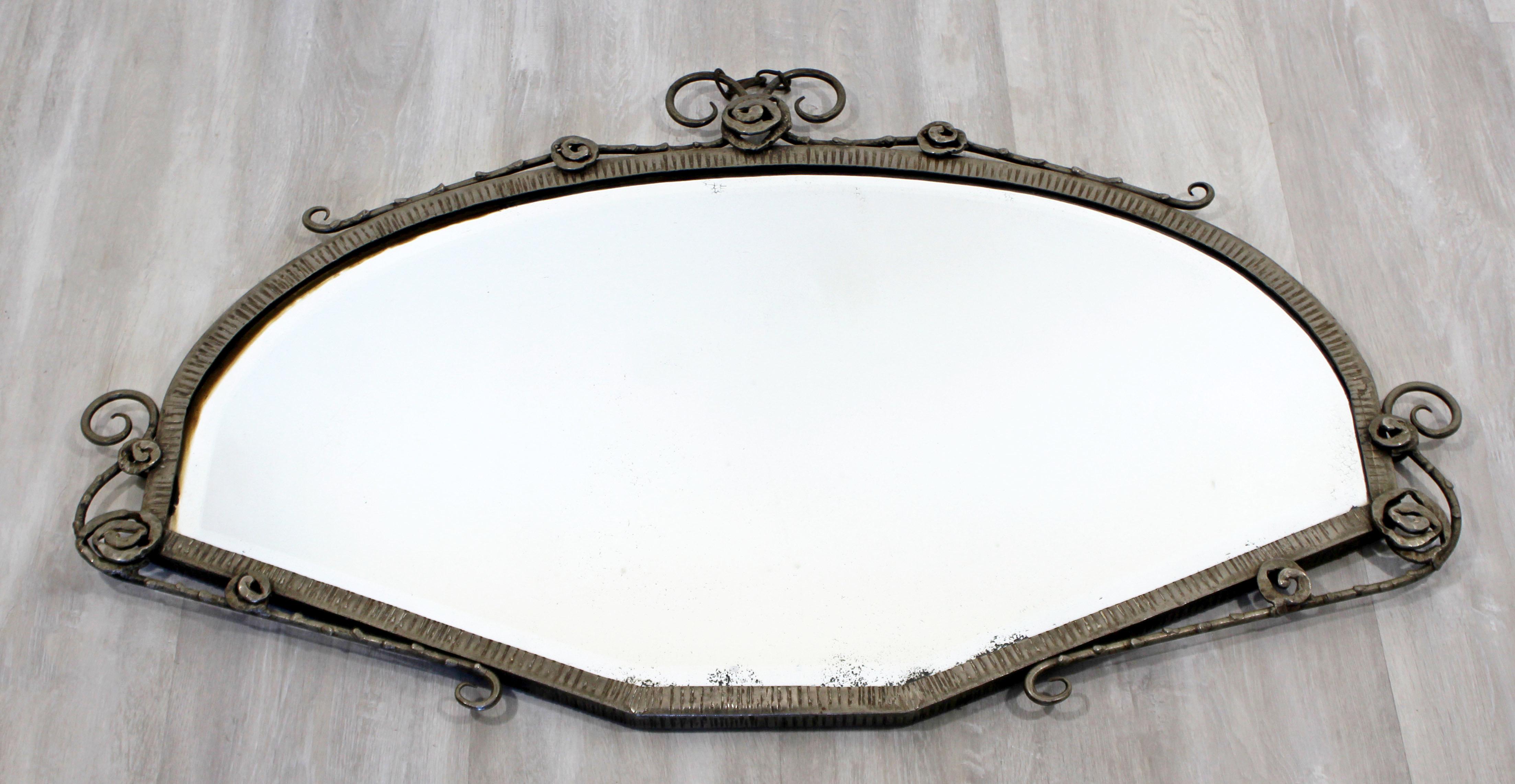 For your consideration is a phenomenal, French Fer Forge iron wall mirror, with a flower design. Attributed to Paul Kiss or Edgar Brandt. In very good antique condition. The dimensions are 36.5