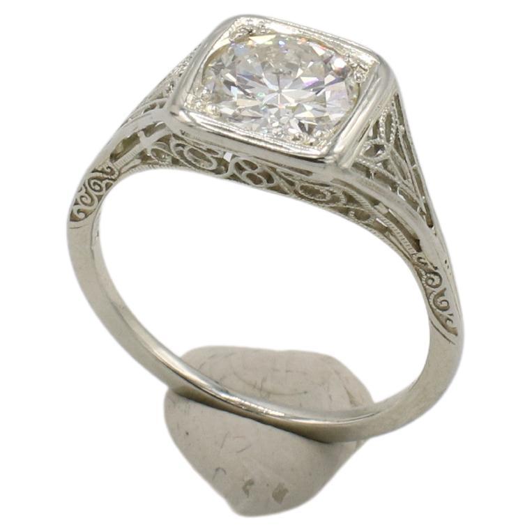 Art Deco Antique Old European Cut Natural Diamond Engagement Ring
Metal: 18k white gold
Weight: 2.63 grams
Diamond: Approx. 1.30 carat J I1 old European cut natural diamond. 
Top width: 8.8mm
Height: 5mm
Size: 6 (US)
