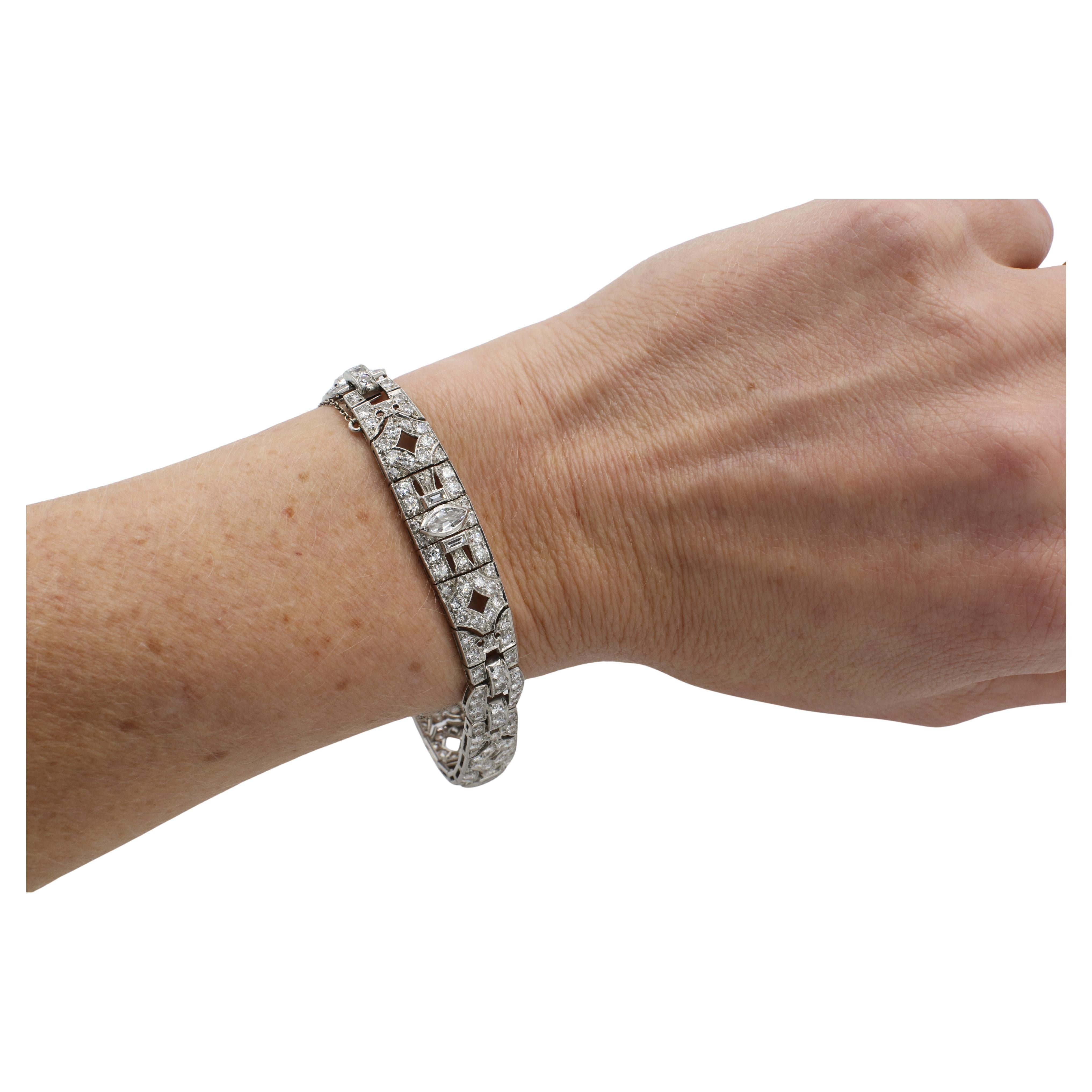 Art Deco Antique Platinum 7.00 Carat Natural Diamond Bracelet 
Metal: Platinum
Weight: 27.9 grams
Diamonds: Approx. 7.00 CTW natural marquise, old European cut, baguette H-I VS diamonds
Length: 7.25 inches
Width: 10mm
