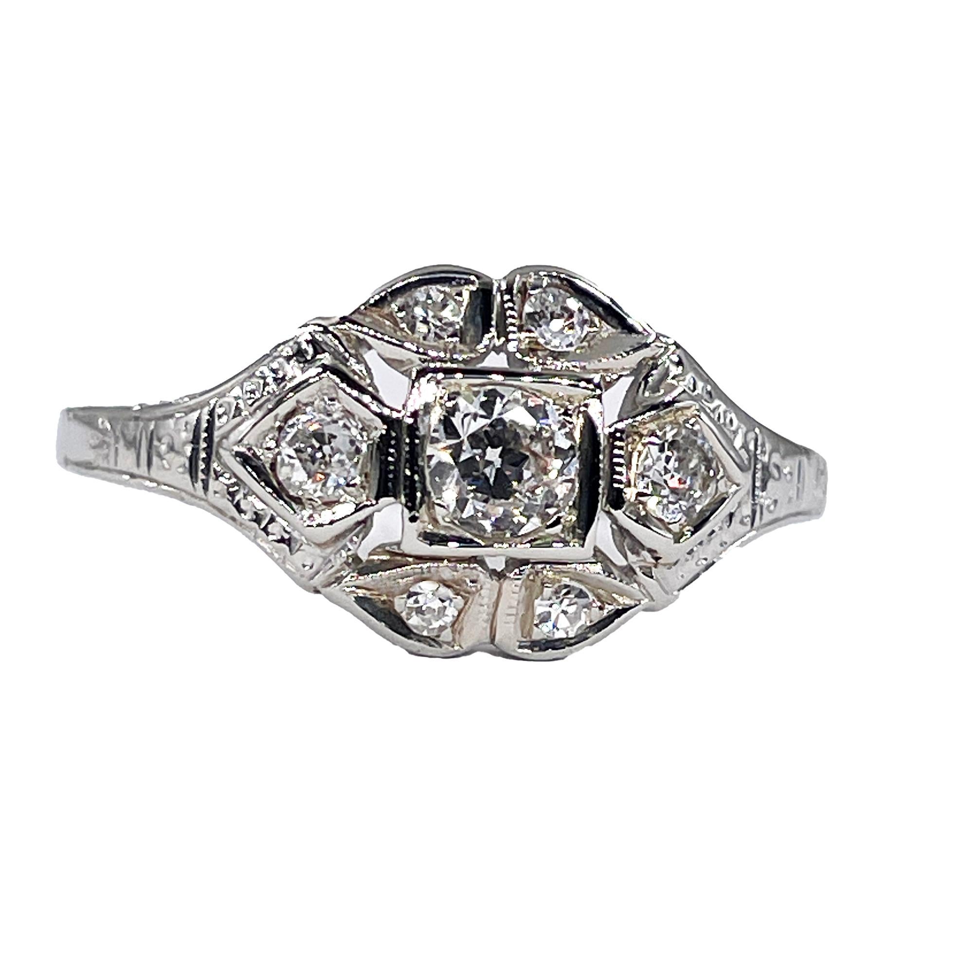 This Authentic 1930s vintage engagement ring incorporates the gleaming precious metal with an artistic grace and beauty that transcends specific Art Deco style.

The stylized cigar-band style ring gently curves around and hugs your finger and
