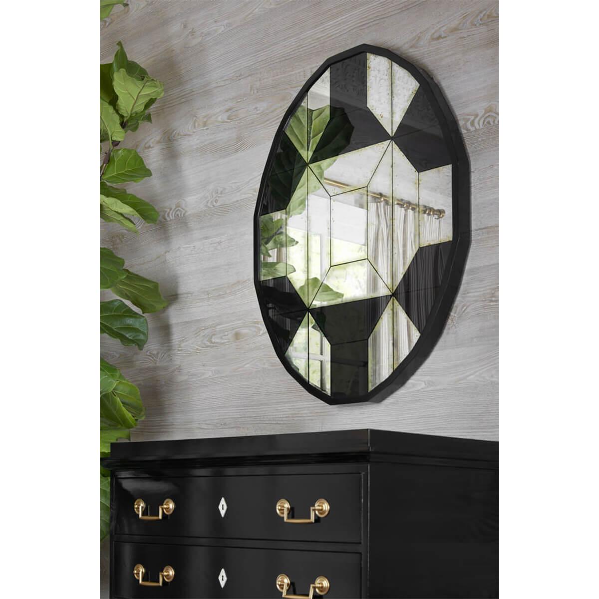 An Art Deco-inspired jeweled mirror, this faceted mirror plays with illusion and reflection using eglomise and antiqued mirror all in the service of high impact.

Dimensions: 30.25