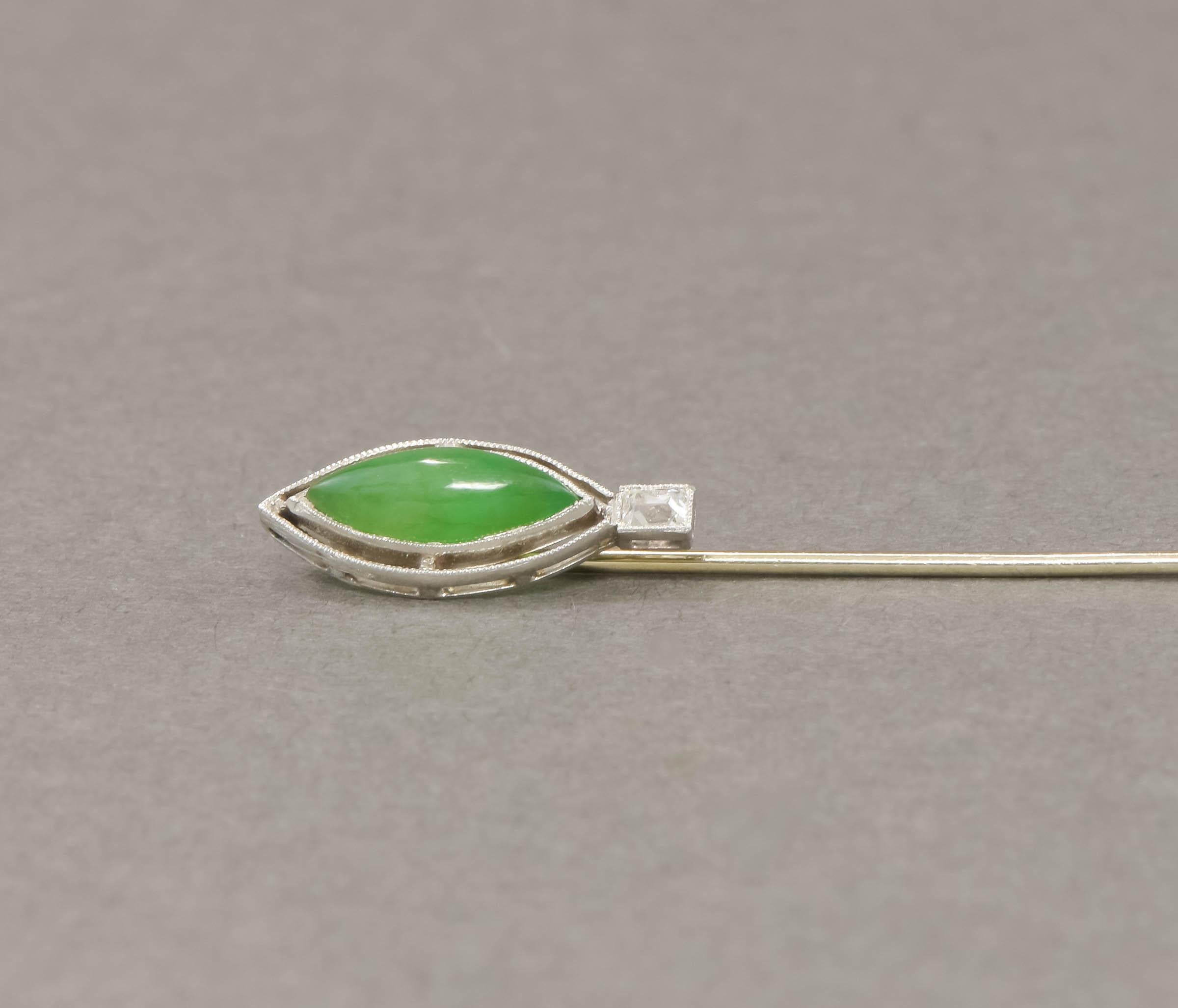 Offered is a very elegant Jadeite and diamond stick pin/cravat pin dating to the Edwardian to Art Deco period.

The jadeite jade and old cushion cut diamond are set in platinum bezels with crisp milgrain edging, while the pin stem tests as 18K white