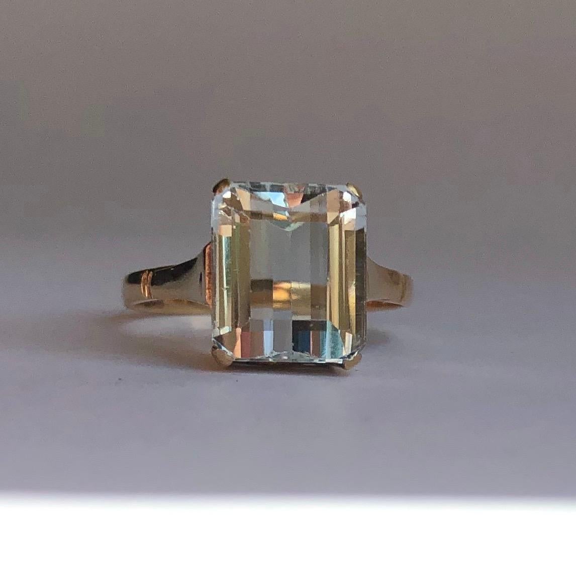 This stunning aqua is pale in colour and has a cut which gives a hall of mirrors effect. The shoulders, setting and band is modelled in 9ct gold and is very simple in design. The stone measures 2.5carat. 

Ring Size: K 1/2 or 5 1/2 
Height Off