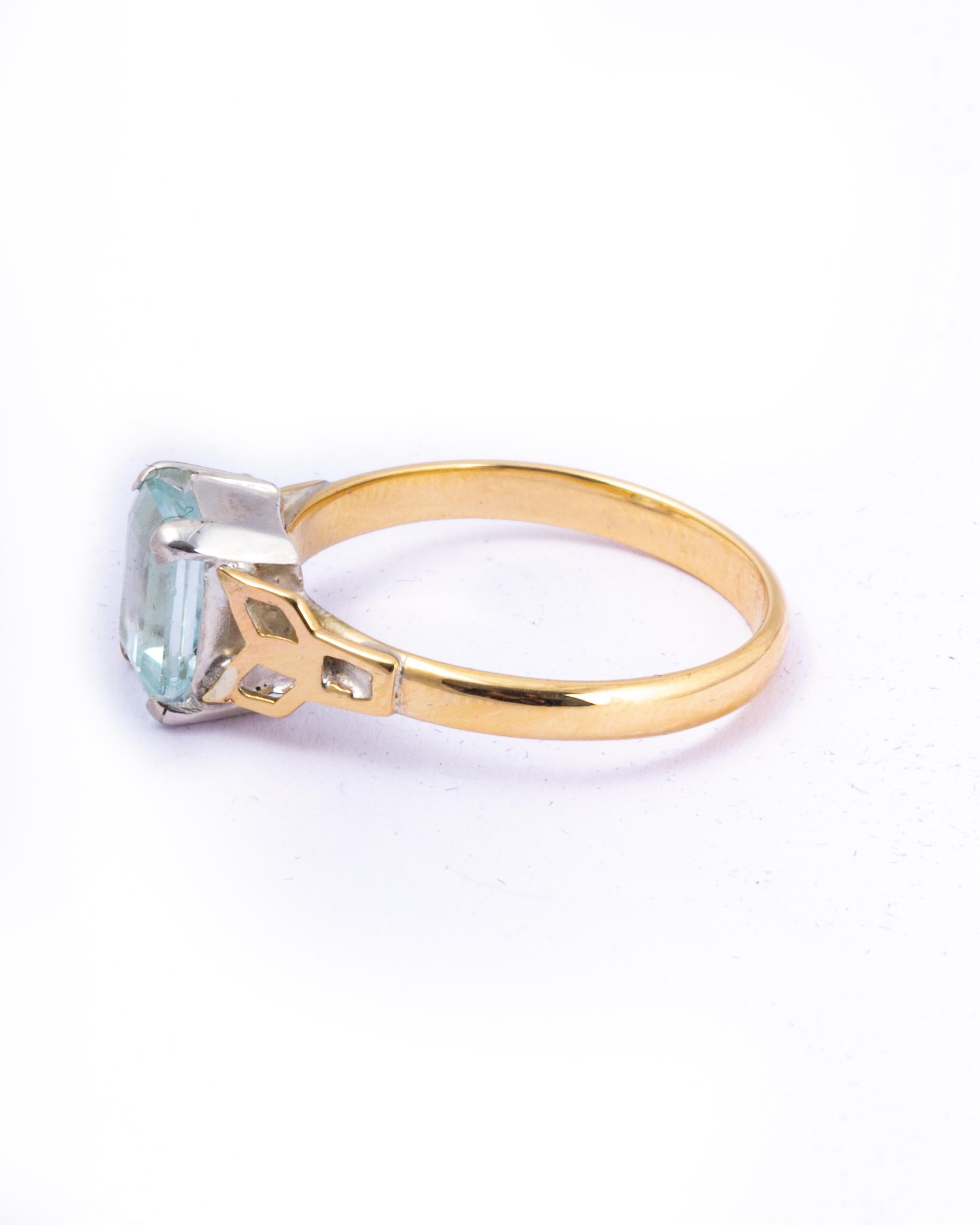 This stunning aqua is pale in colour and has a cut which gives a hall of mirrors effect. The shoulders, setting and band is modelled in 9ct gold and is very simple in design. The stone measures 0.75carat. 

Ring Size: O or 7 1/4 
Height Off Finger: