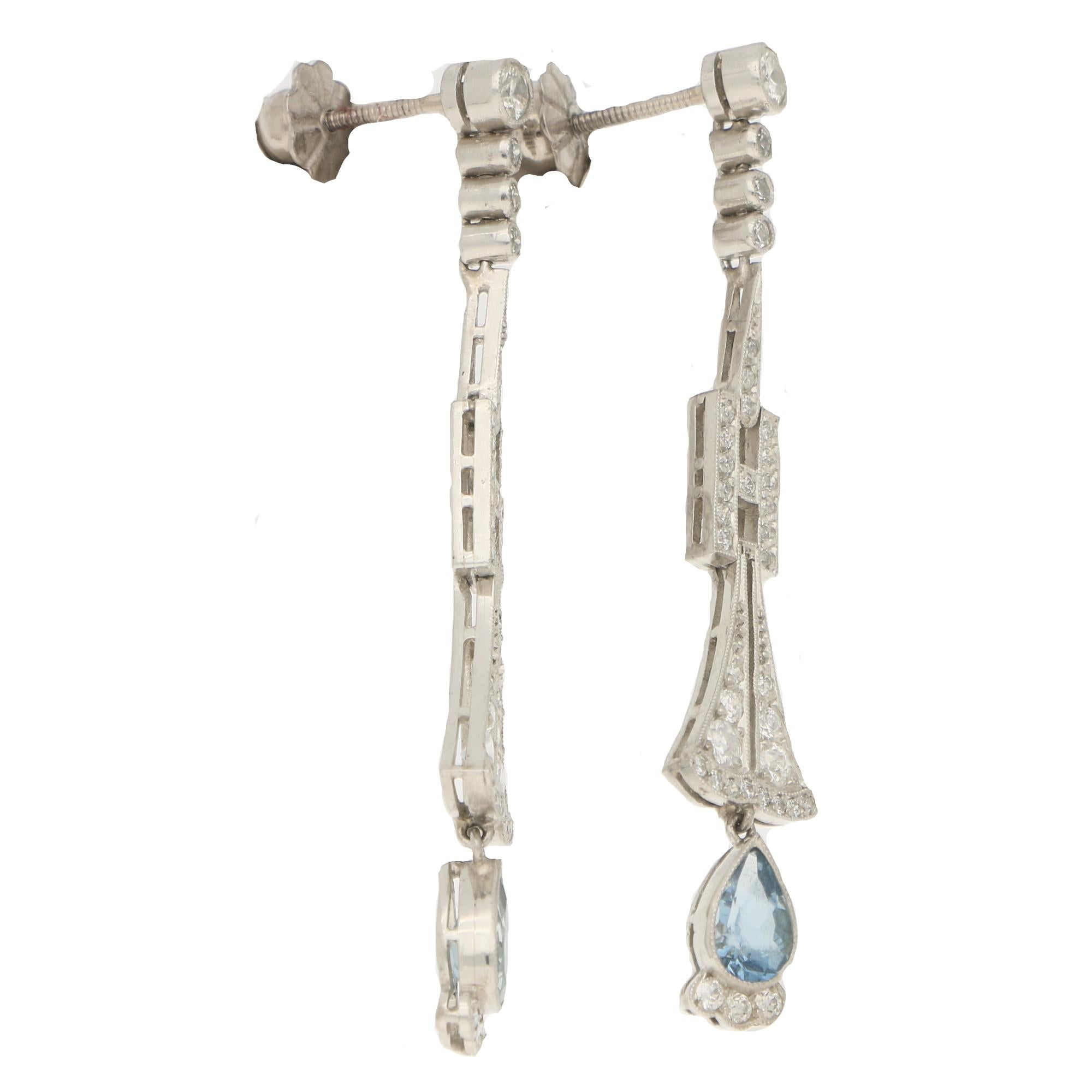 A beautiful pair of Art Deco aquamarine and diamond drop earrings set in platinum. 

Each earring is composed of a 0.30 carats pear shape aquamarine set in an open back millegarin setting with three Old European cut diamonds in millegrain settings