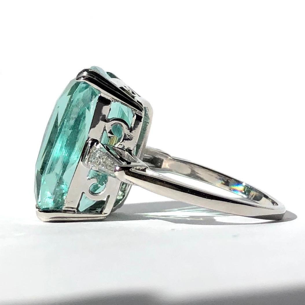 This ring is an absolute show stopper! The colour of the 20ct aqua stone is simply stunning, it is also cut beautifully which really shows off the colour of the stone. The shoulders hold baguette diamonds which add a great bit of extra sparkle.