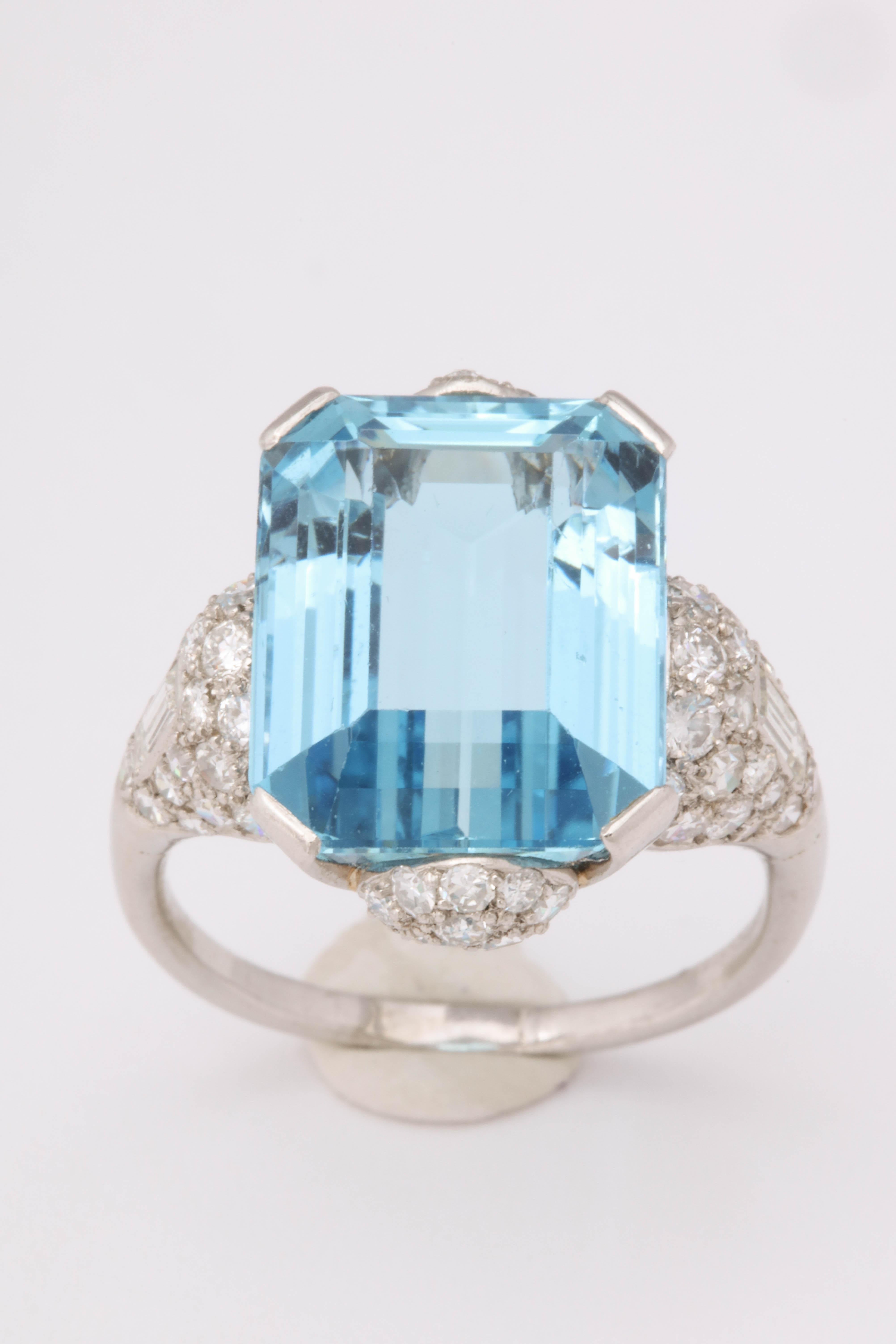 10.1 ct aquamarine set in a platinum mount. The mount is set with varying old cut diamonds including baguettes on the shoulders. Diamonds also set north/south of the aqua. Stunning mount and stones, made c. 1935. 