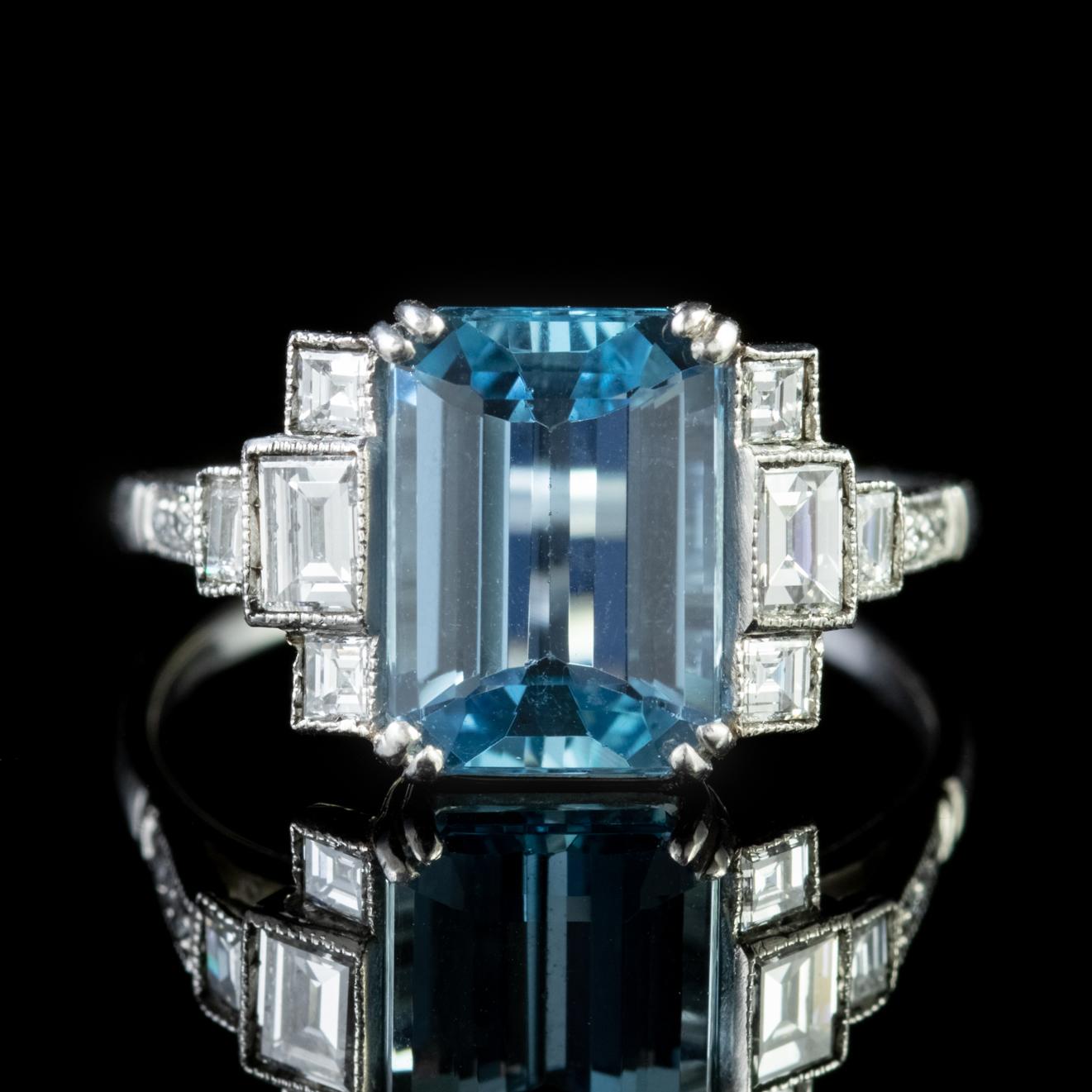 This magnificent genuine Art Deco Aquamarine and Diamond ring boasts an impressive 3.50ct emerald cut Aquamarine flanked by baguette and princess cut Diamonds on each shoulder. The Diamonds are beautiful VS1, H colour stones totalling approx.