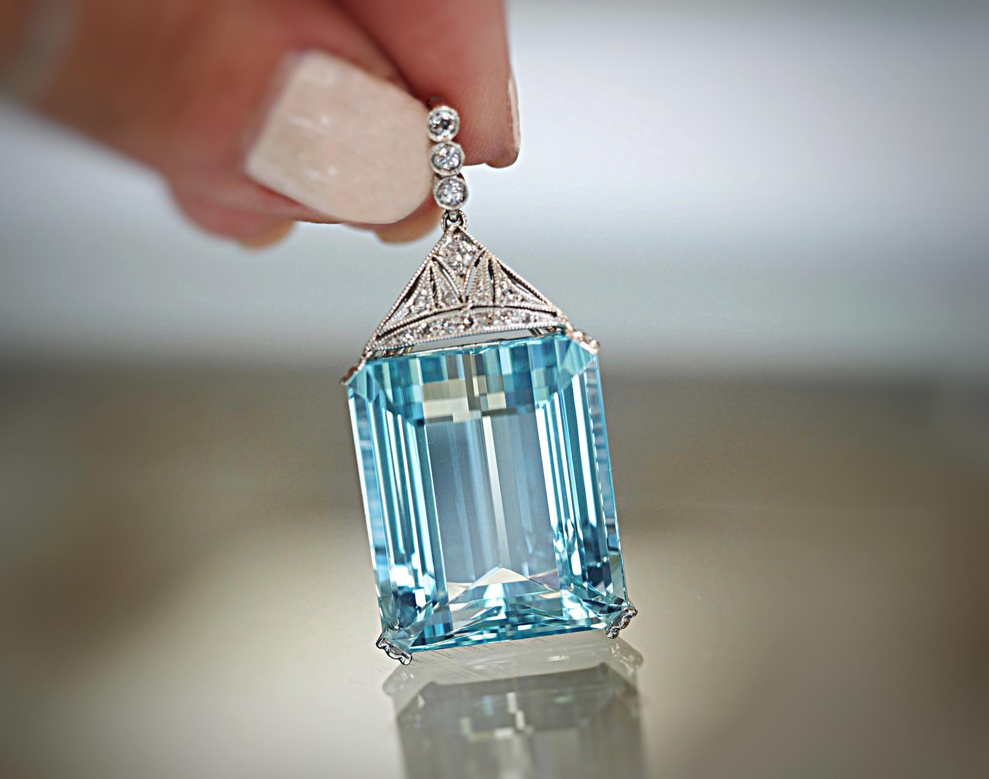This incredible  aquamarine necklace is a true treasure . The emerald cut aquamarine weighs 47.83 carats and measures 24 MM x 19.55 MM x 2.70 MM. It has the desirable blue color that is mesmerizing to look at. The design the aquamarine is set in has