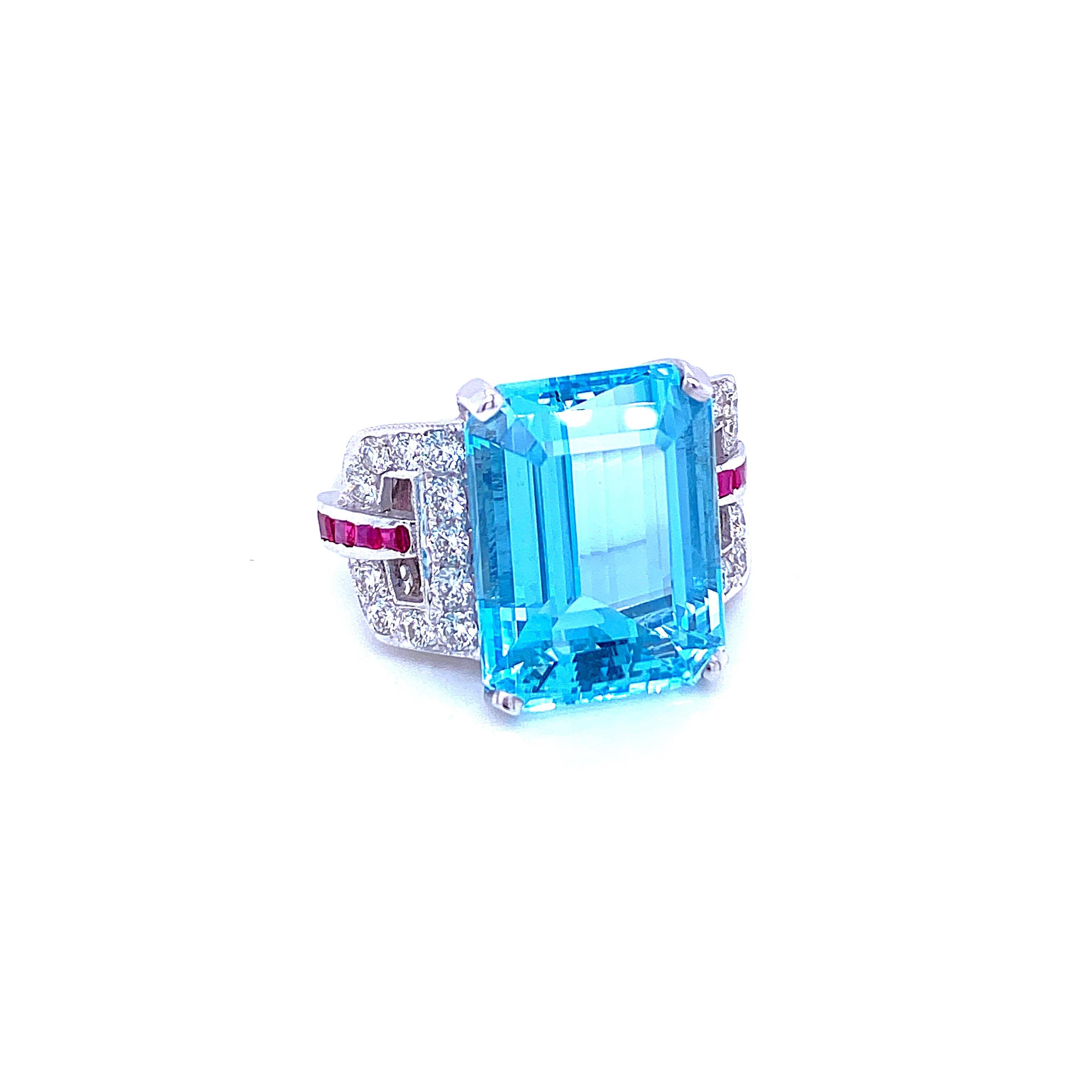 Art Deco style ring set in the center with a stunning Aquamarine weighing 15,74 carats graded AAAA, and surrounded by approx. 0.40 carat of custom cut Rubies and 0.90 ct of round brilliant cut diamonds graded G Color Vvs Clarity, Remarkable