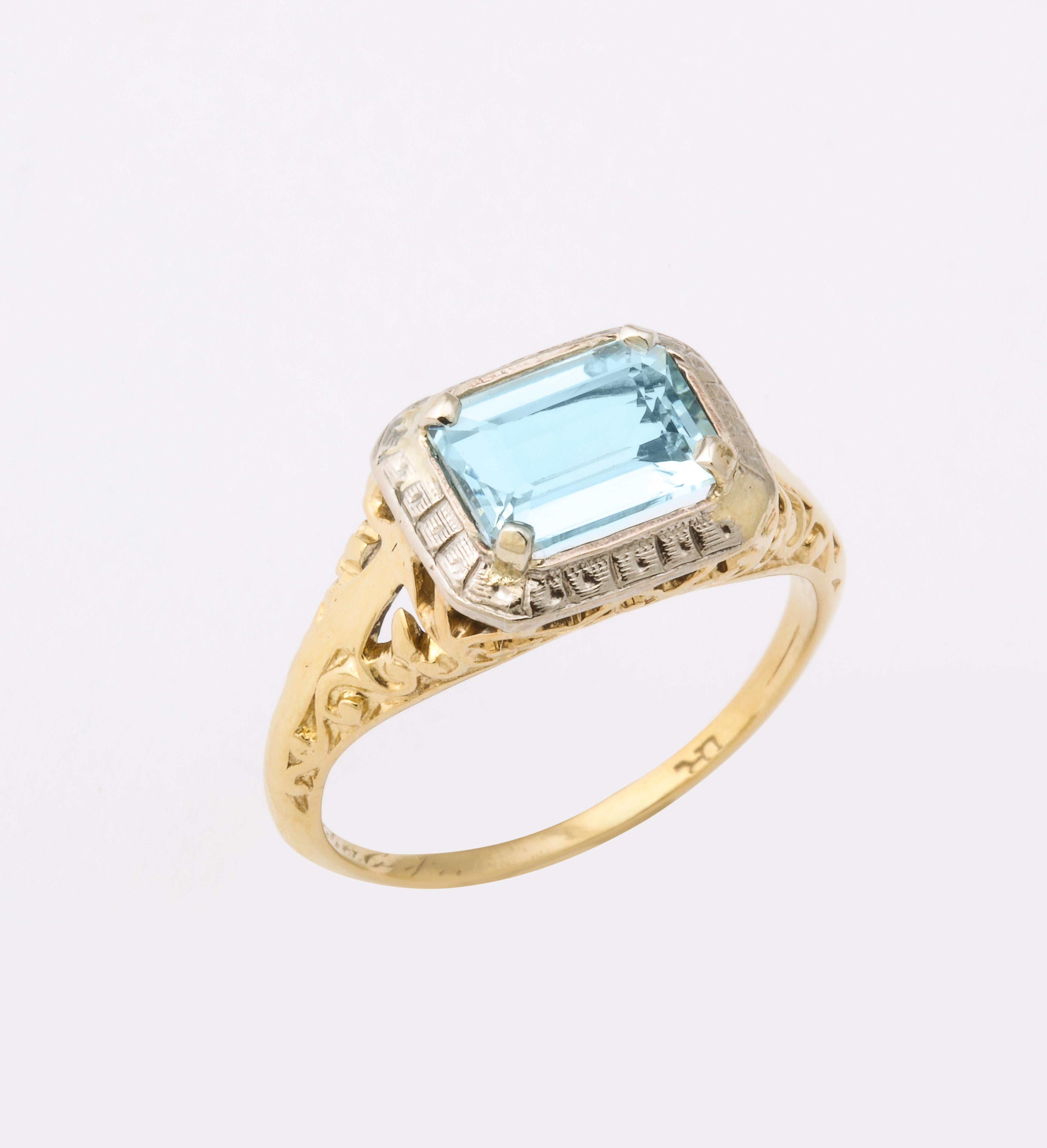 An alluring aquamarine Art Deco Ring in an east west setting. Loved since ancient times, it is beloved and desirable today.  Color is affecting and this gem simply feels good on the body. The beautiful watery blue stone suits every skin tone. Large