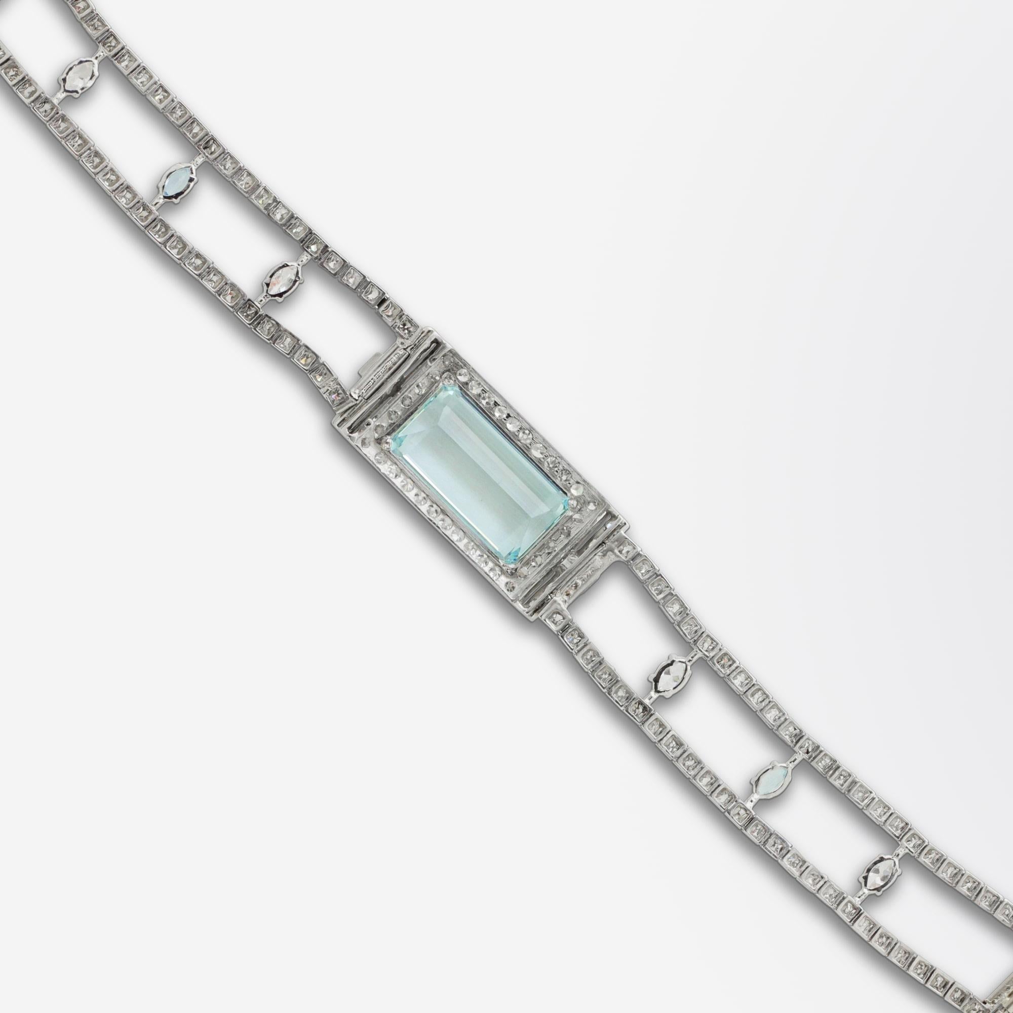 An incredible Art Deco diamond and aquamarine bracelet set in platinum. The central panel features an octagonal cut aquamarine set north south with a weight of 9.85 carat. This central stone has an accompanying GIA certification describing it as