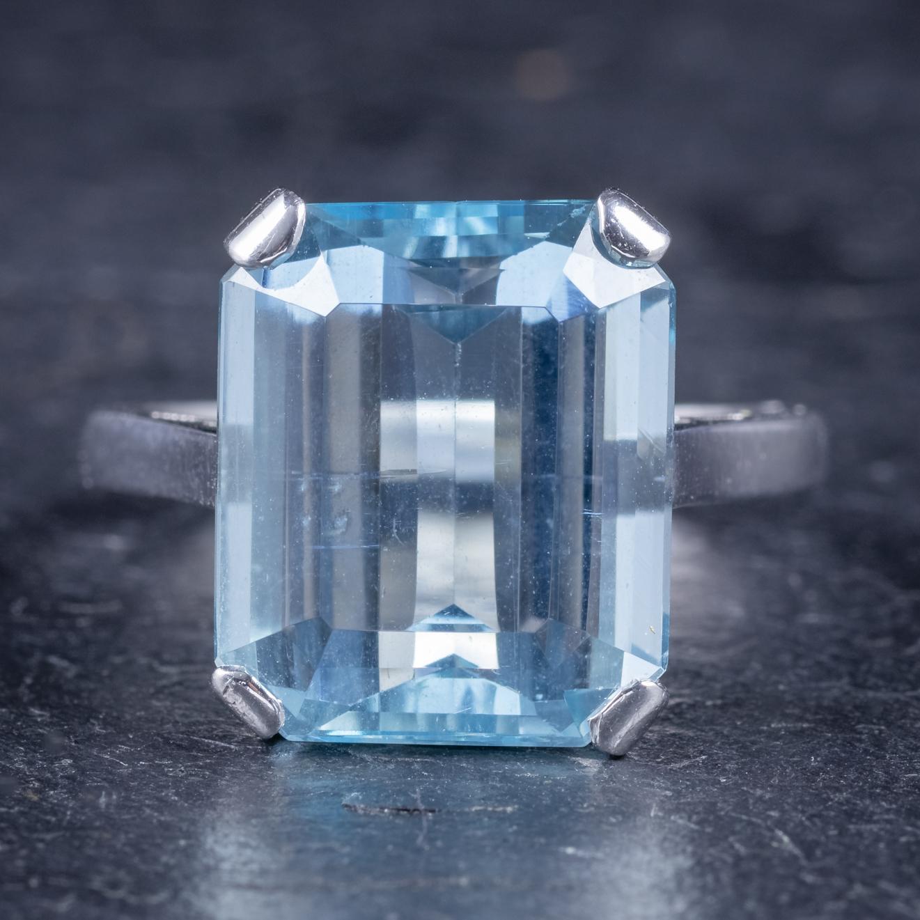 A stunning Art Deco ring C.1930, set with a lovely ocean blue Aquamarine. 

The Aquamarine is emerald cut and is an impressive 9ct stone. 

The gallery is set in Platinum and 18ct White Gold and stamped -18ct/ Plat - with makers initials - B.K.T -