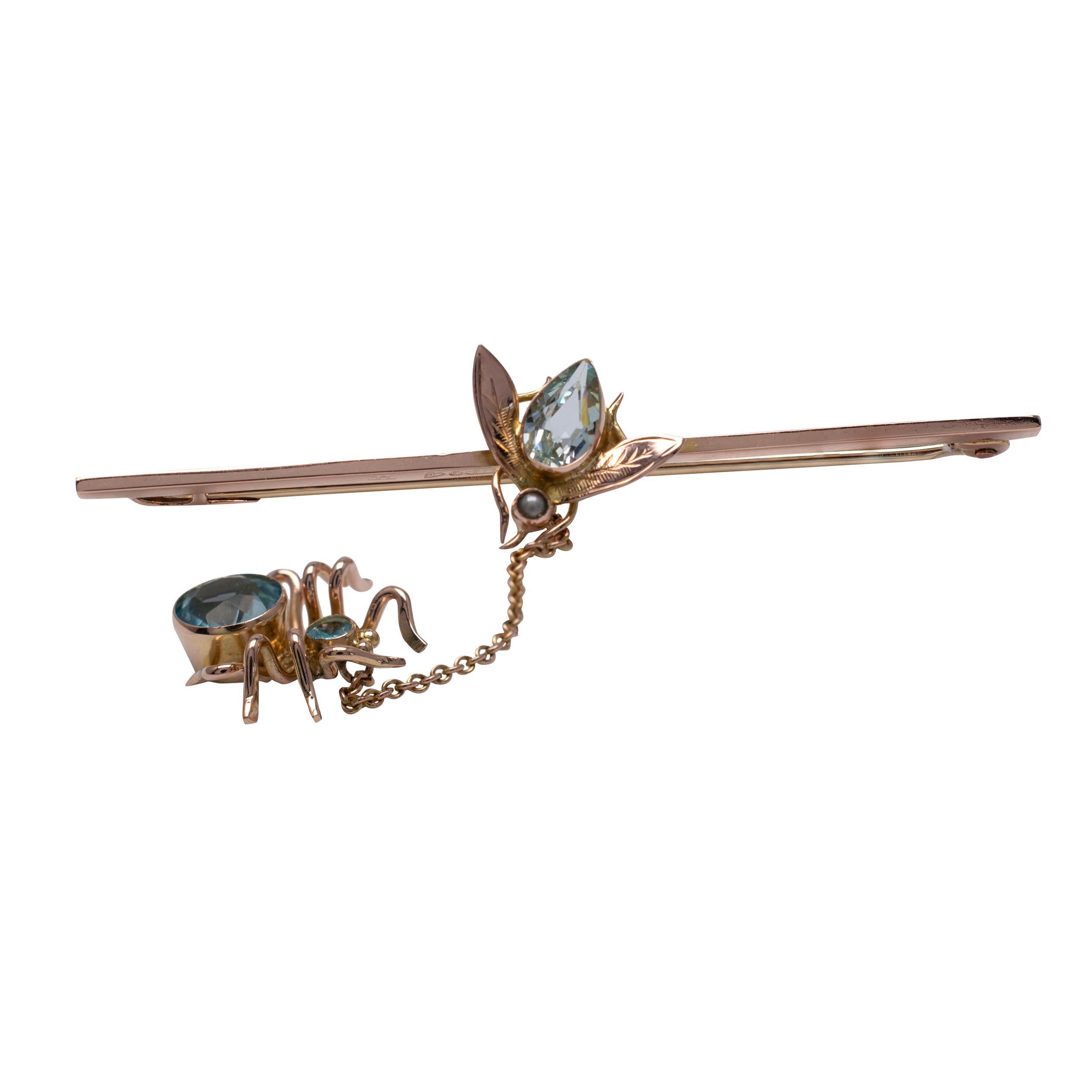 This fabulous antique Art Deco fly and spider brooch is crafted in 9 karat rose gold and features aquamarine, topaz and pearl gemstones. Clearly hallmarked for Chester 1921.

Fly set with a single bezel set 0.65-carat pear cut aquamarine with a