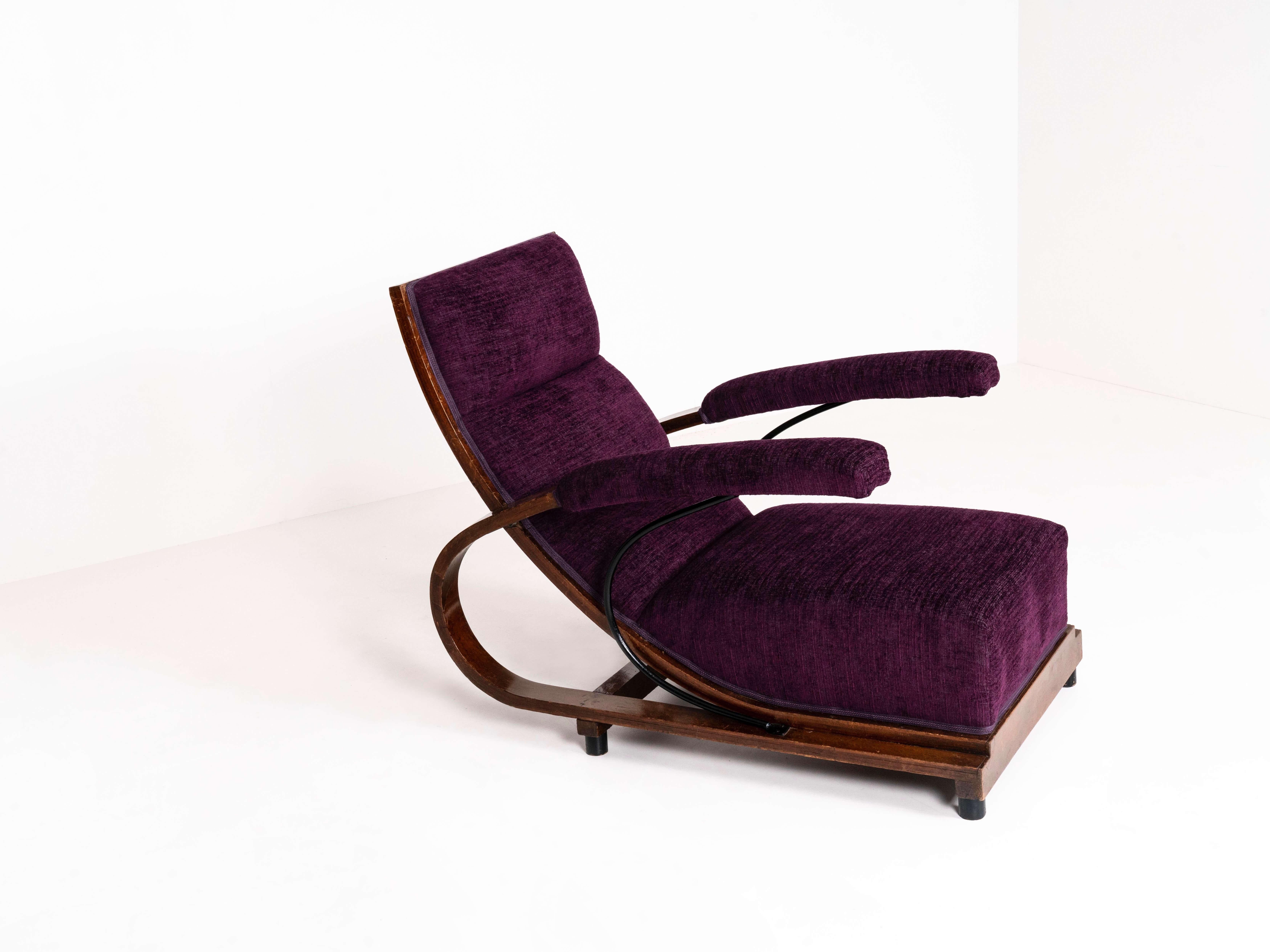 Rare Art Deco armchair by Luigi Carlo Daneri from Italy 1933. This chair in walnut and bent plywood has an exceptional design with a metal tube to reinforce the armrests. This chair is completely re-upholstered in dark purple, wine-colored fabric.