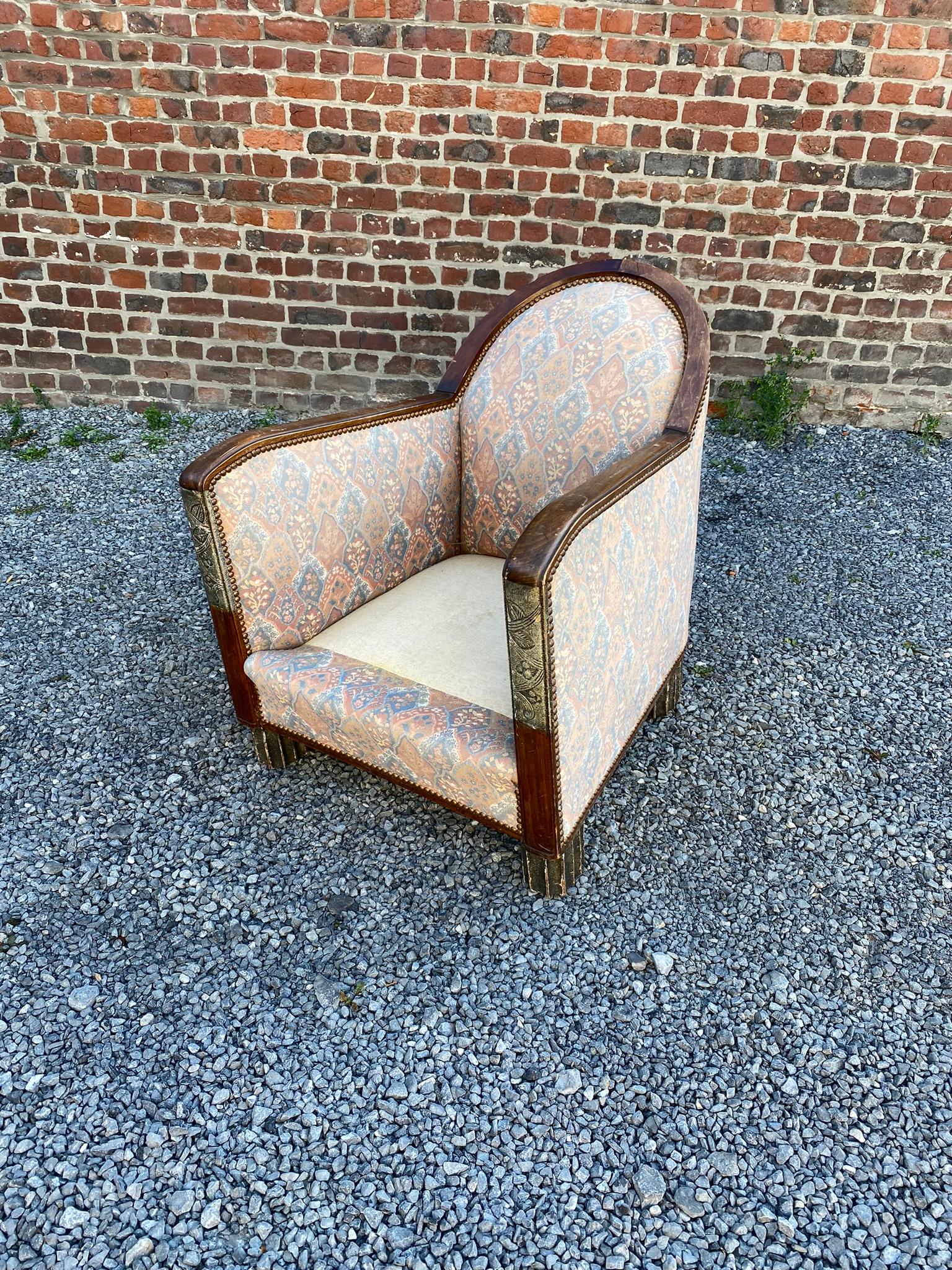 Art Deco armchair, circa 1930
carved and partially silvered uprights.
 