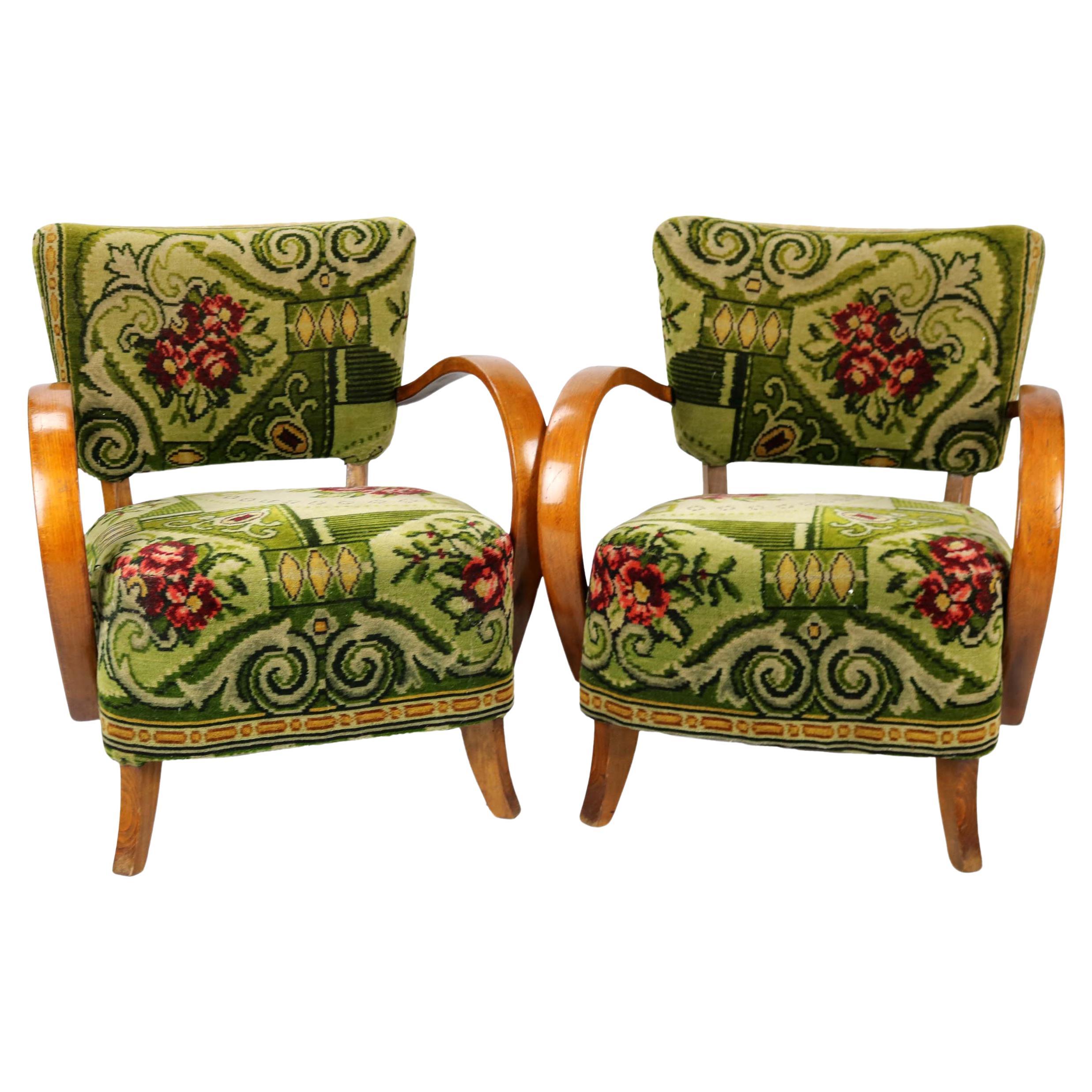 This beautiful set of floral patterned Art Deco armchairs will uplift any libing room or conservatory with its beauty and craftsmanship. The armchairs were designed by the reknowned Czech designer Jindrich Halabala. The armchairs are not only