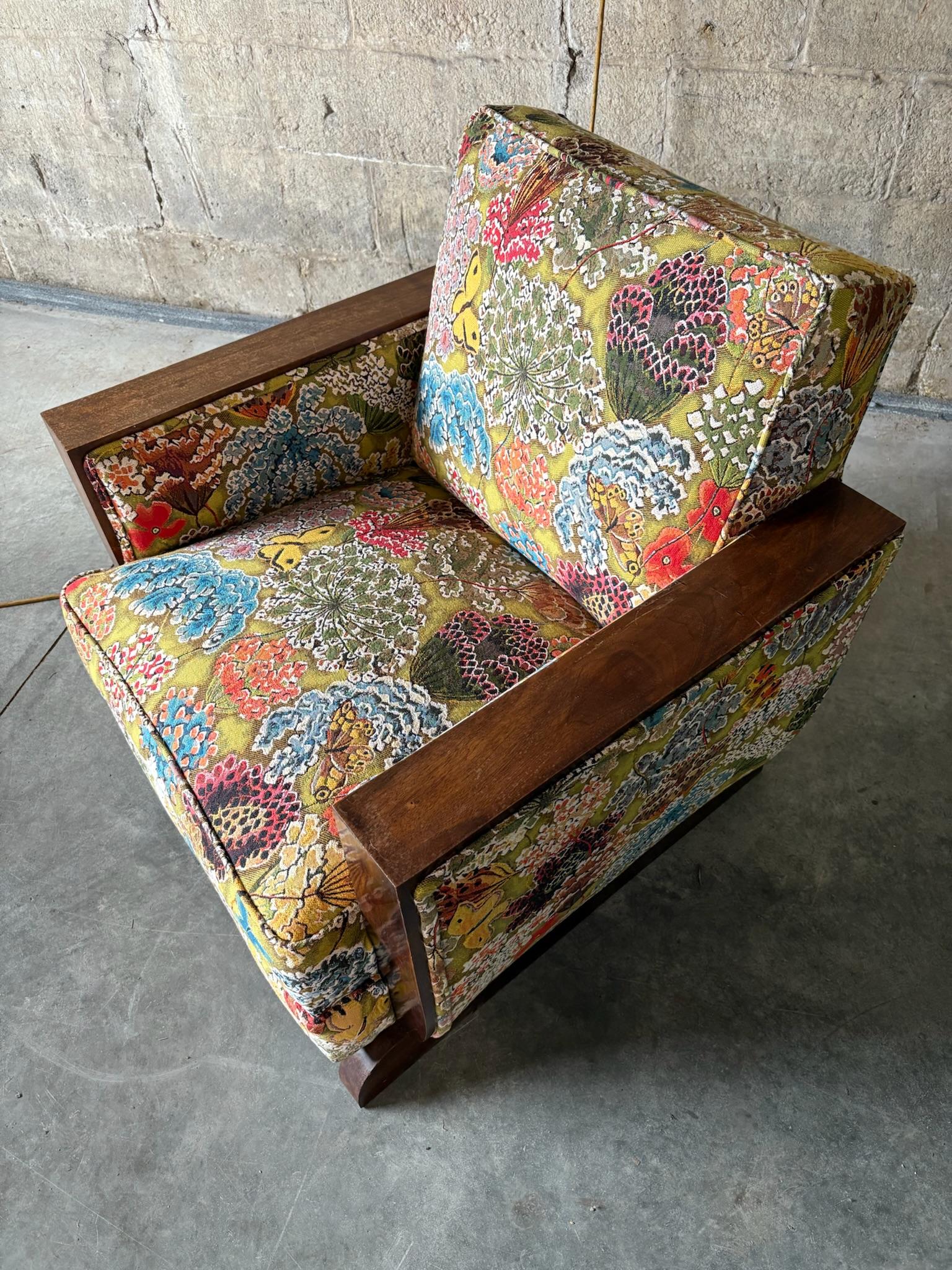 A true one-of-a-kind chair. A beautiful original Art Deco armchair with walnut arms and feet. Newly recovered in high-end Pierre Frey Fabric. Deep cushion and solid arms makes for a great and versatile club chair. 
