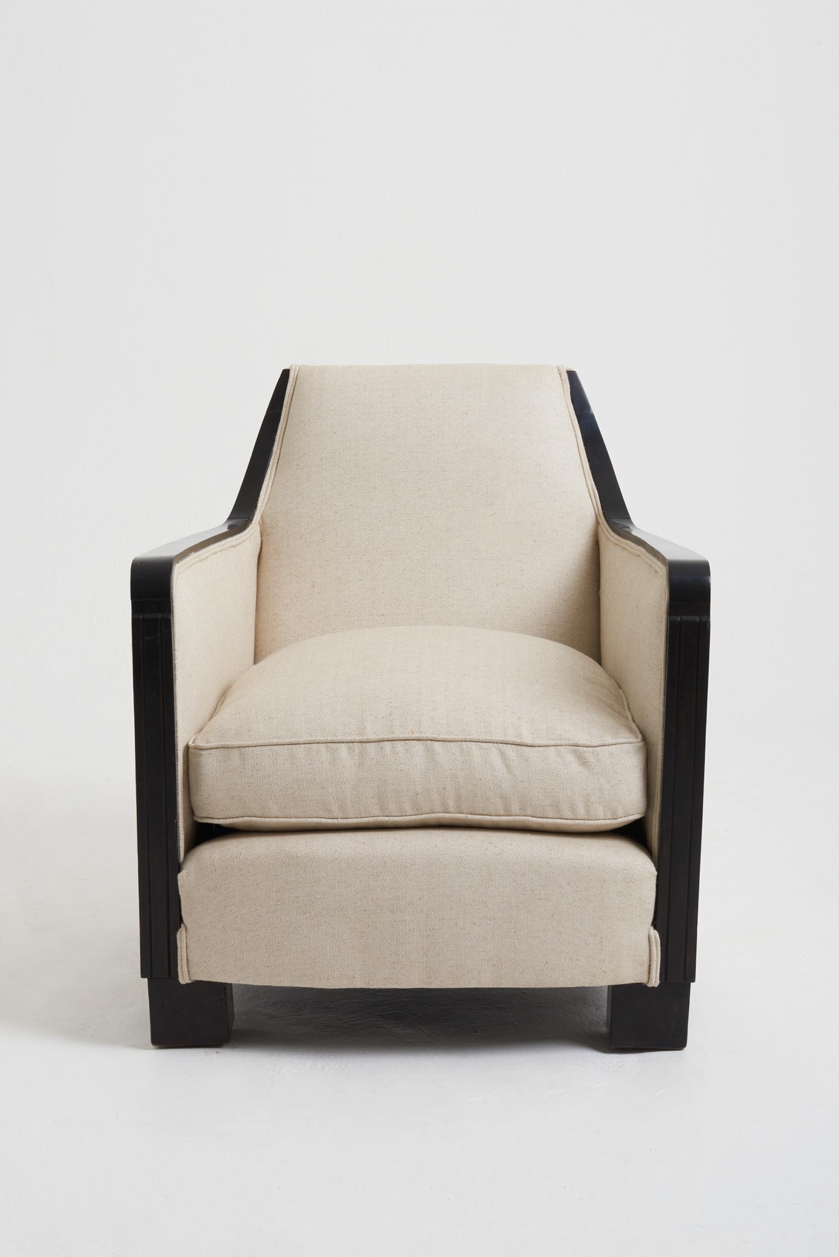 An Art Deco ebonised armchair, probably by Maison Dominique (André Domin (1883-1962) & Marcel Genevrière (1885-1967).
France, circa 1940.