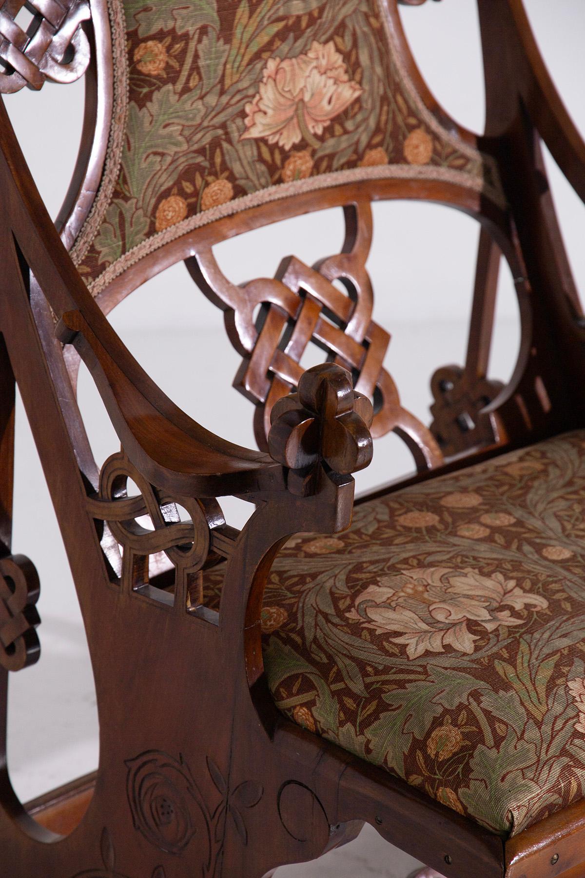 Step back in time with this stunning Art Deco armchair, a beautiful representation of the early 20th century's design aesthetics. Featuring a rich tapestry of floral upholstery and ornate wooden carvings, this chair is a masterpiece that combines