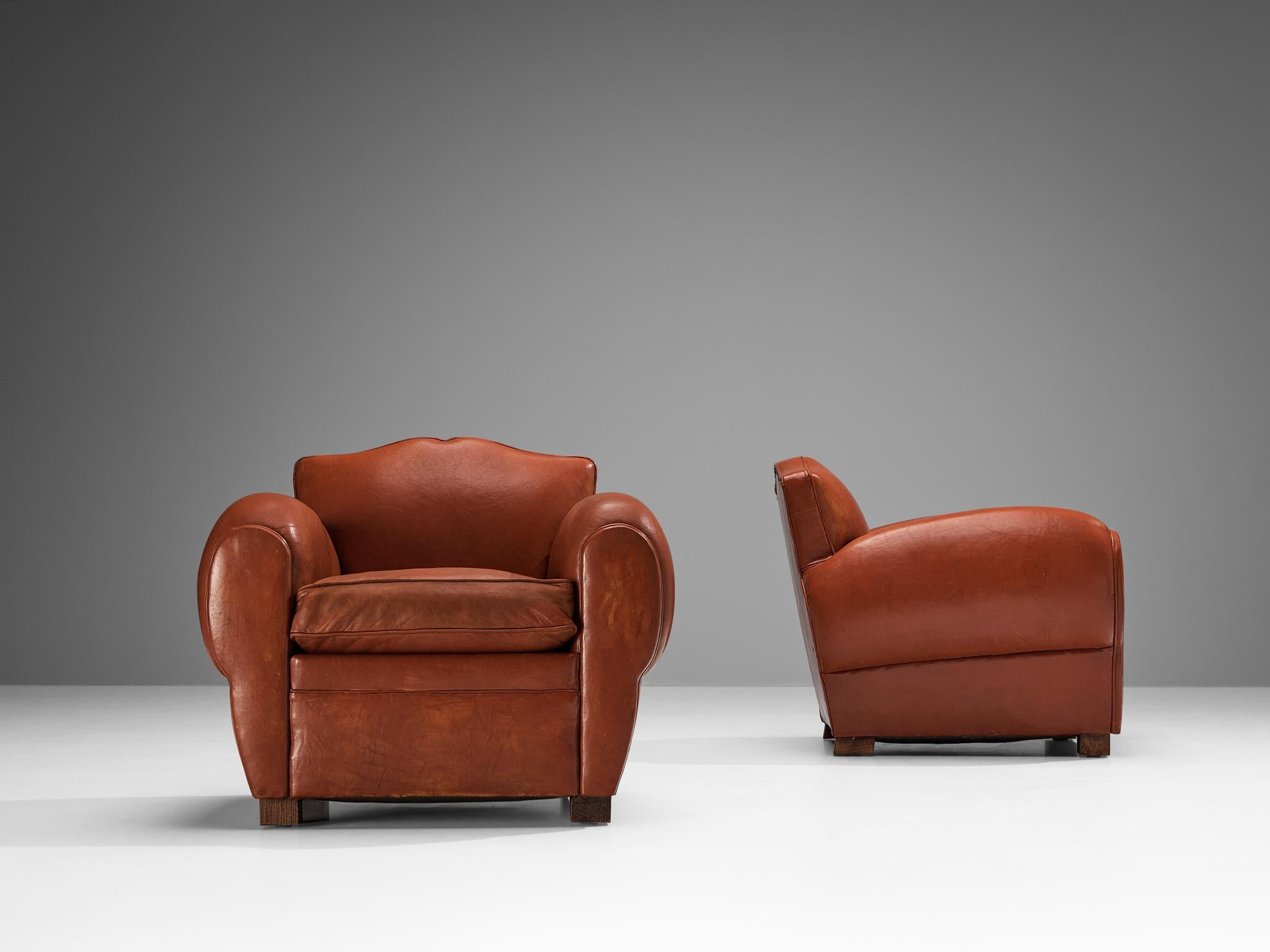 Français Paire de fauteuils Art Déco de Maurice Rinck en cuir en vente