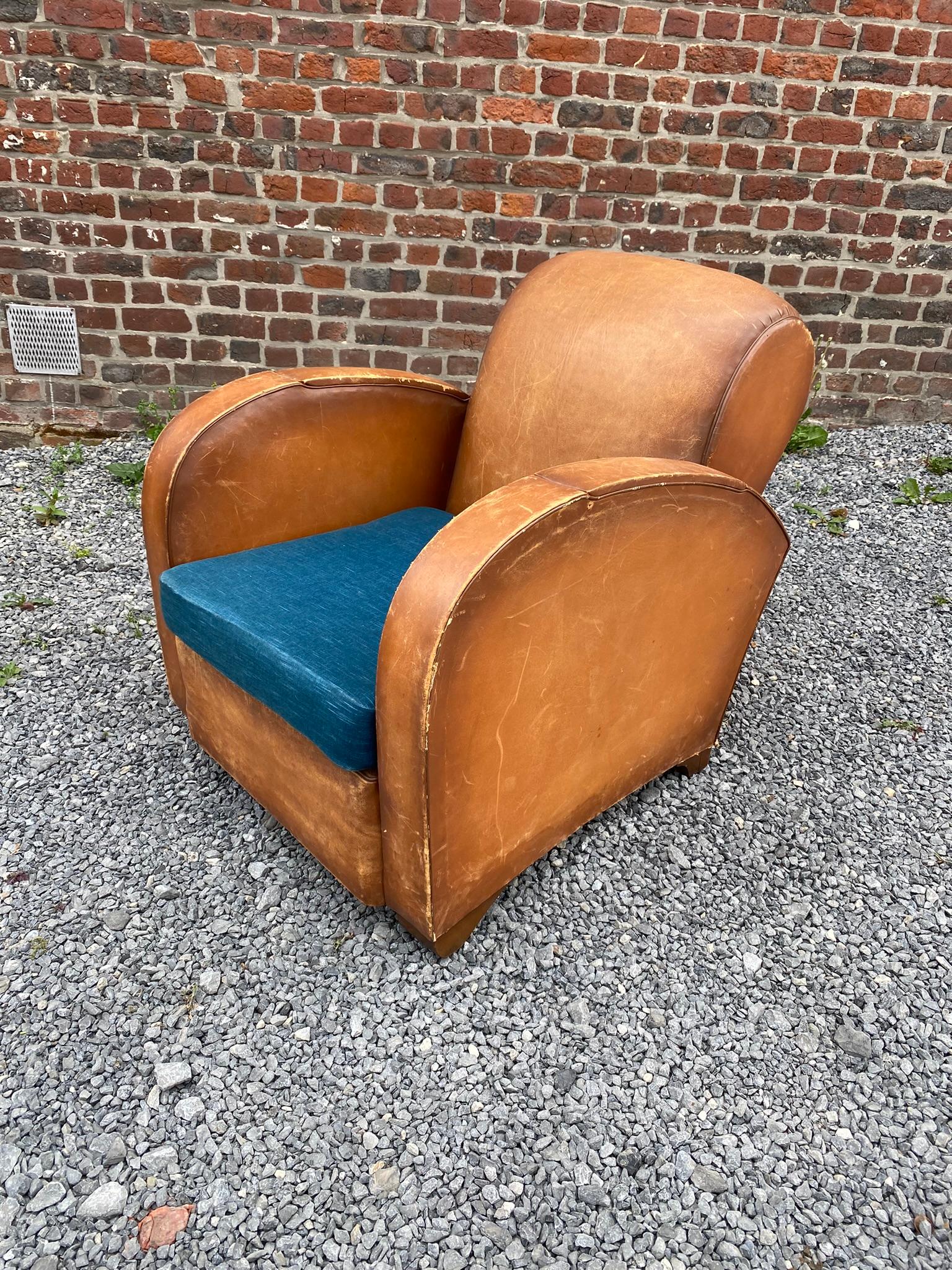 Art Deco armchairs covered in leather, circa 1930.
Lots of wear, but no holes or tears.
 